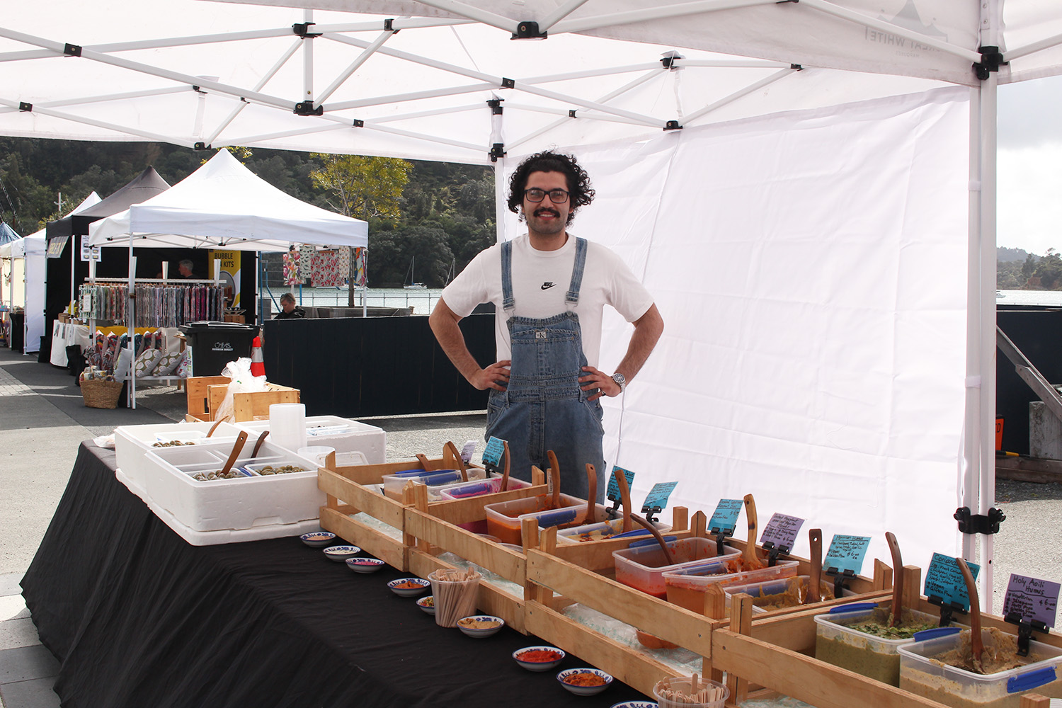Abdullah hosting the Meditteranean Deli stand at the Catalina Bay Market. Photo / Madeleine Crutchley
