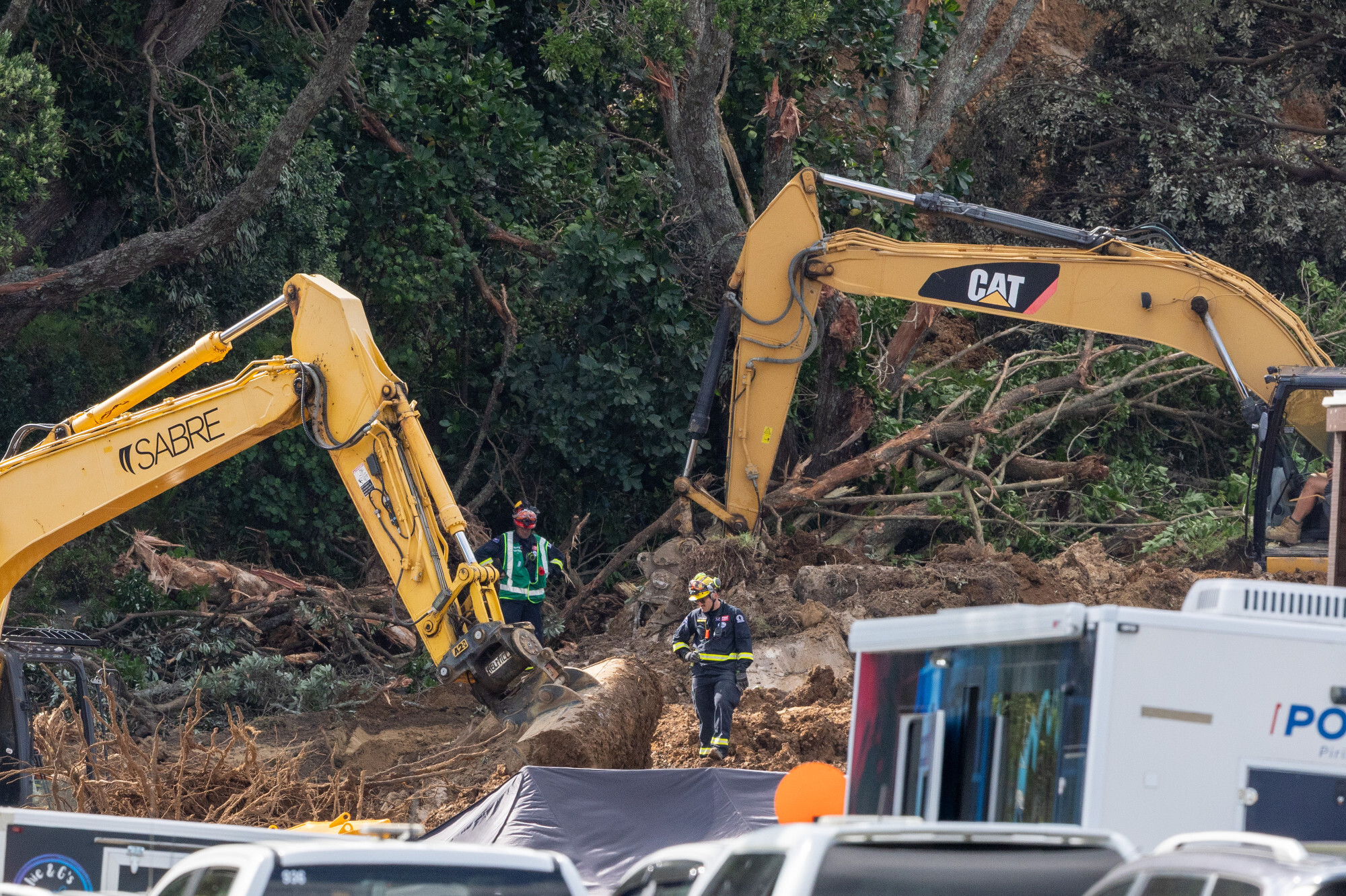 Police, Fire and Emergency New Zealand, Hato Hone St John and security work through the evening at Mount Maunganui campground on January 23, 2026. Photo / Michael Craig