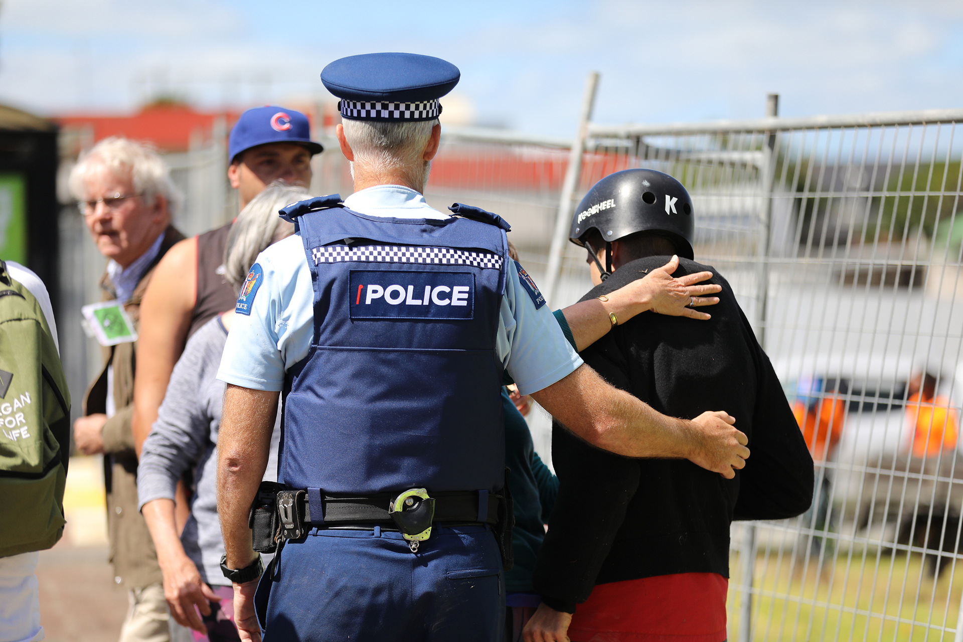 Caleb Azor, 18, is led away by police. Photo / Hayden Woodward