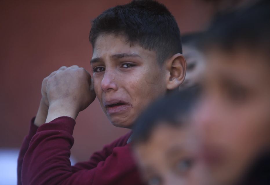 A Palestinian boy cries for his relatives who were killed in the Israeli bombardment of the Gaza Strip, at Nasser hospital in Khan Younis. Photo / AP