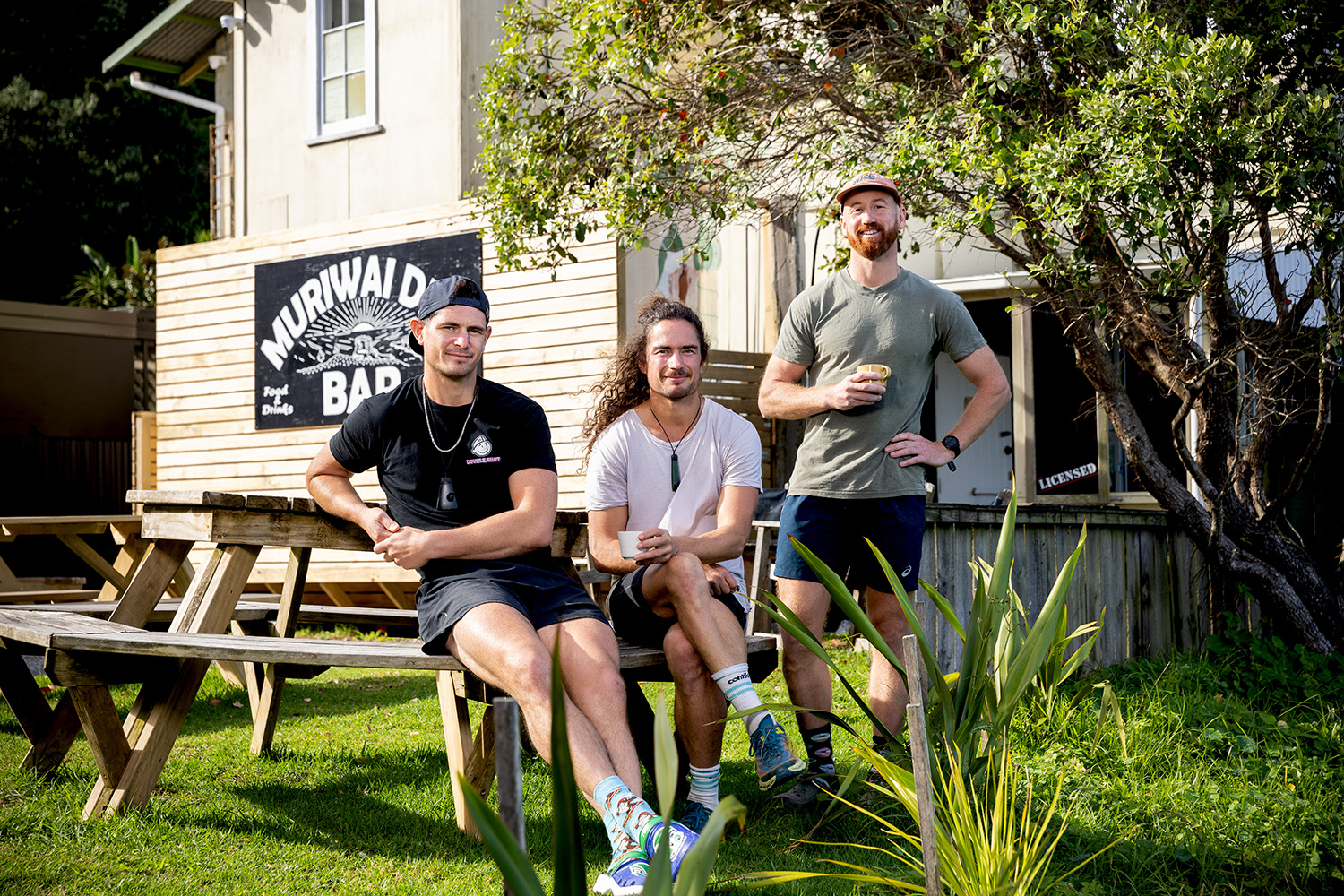 Bryce and Cameron Steel and Damian Watson of the Muriwai Deli. Photo / Babiche Martens