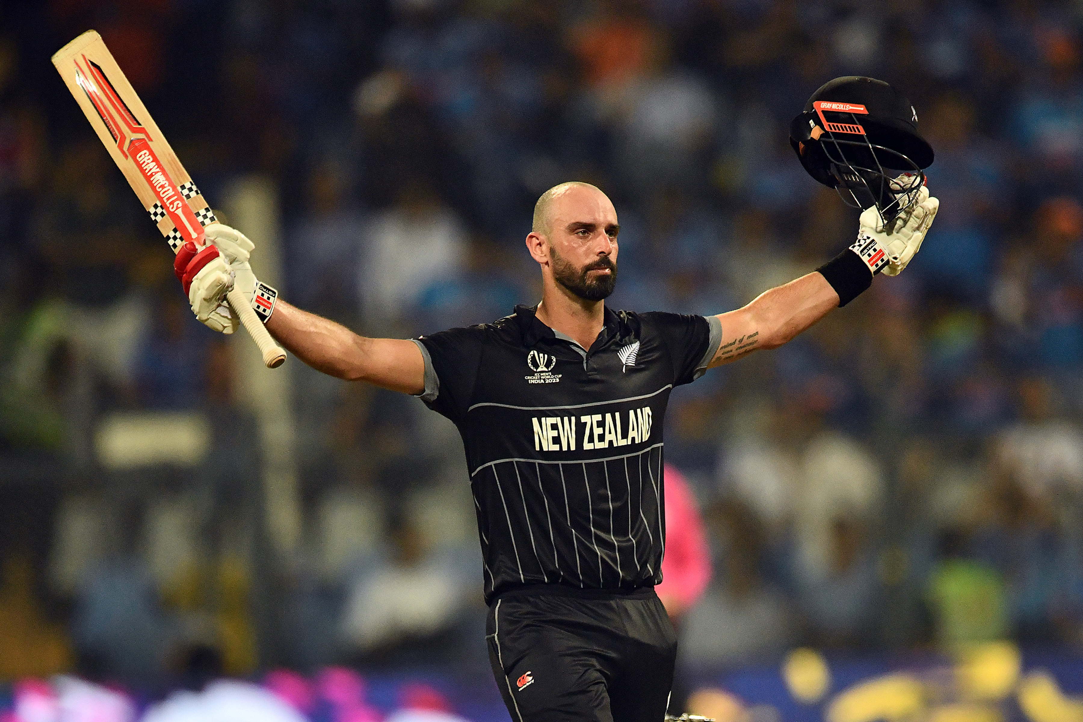 Daryl Mitchell celebrates his century against India. Photo / Photosport
