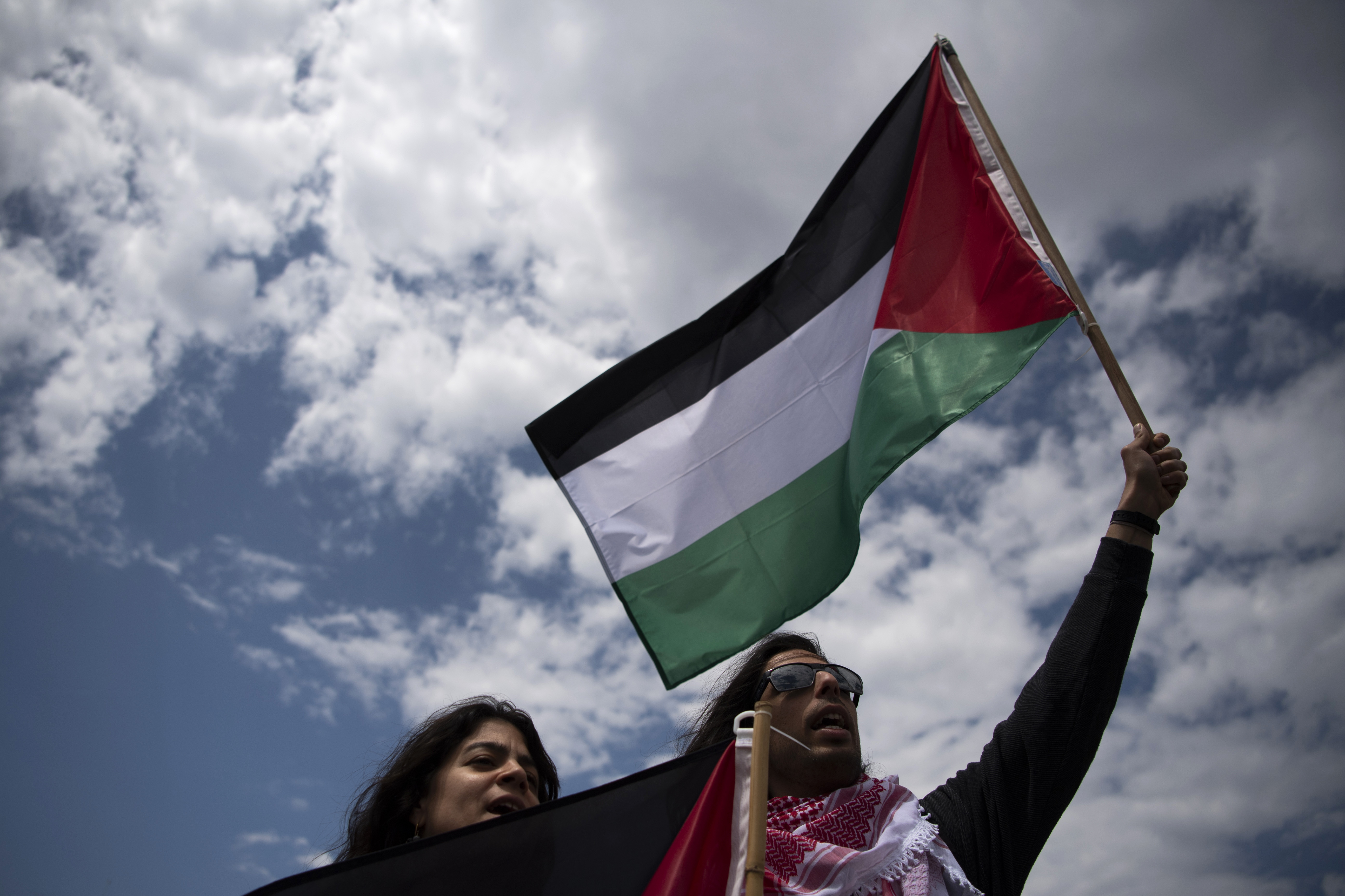 Protesters holding Palestinian flags shout slogans during a protest rally at Syntagma Square, central Athens, Greece. Photo / AP