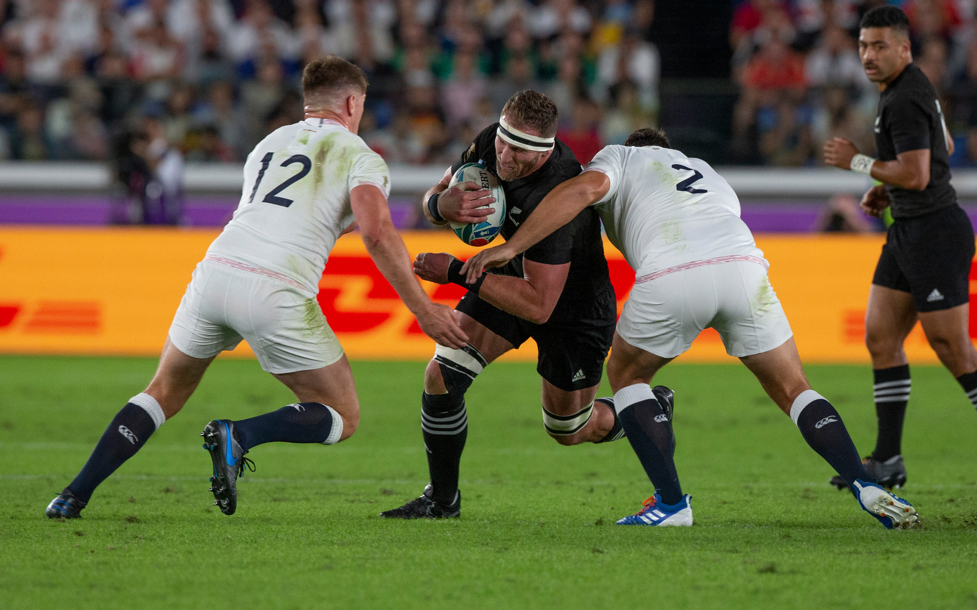 All Blacks captain Kieran Read attempting to break the tackles of England second five-eighths Owen Farrell and hooker Jamie George during the Rugby World Cup semi-final. Photo / Mark Mitchell.