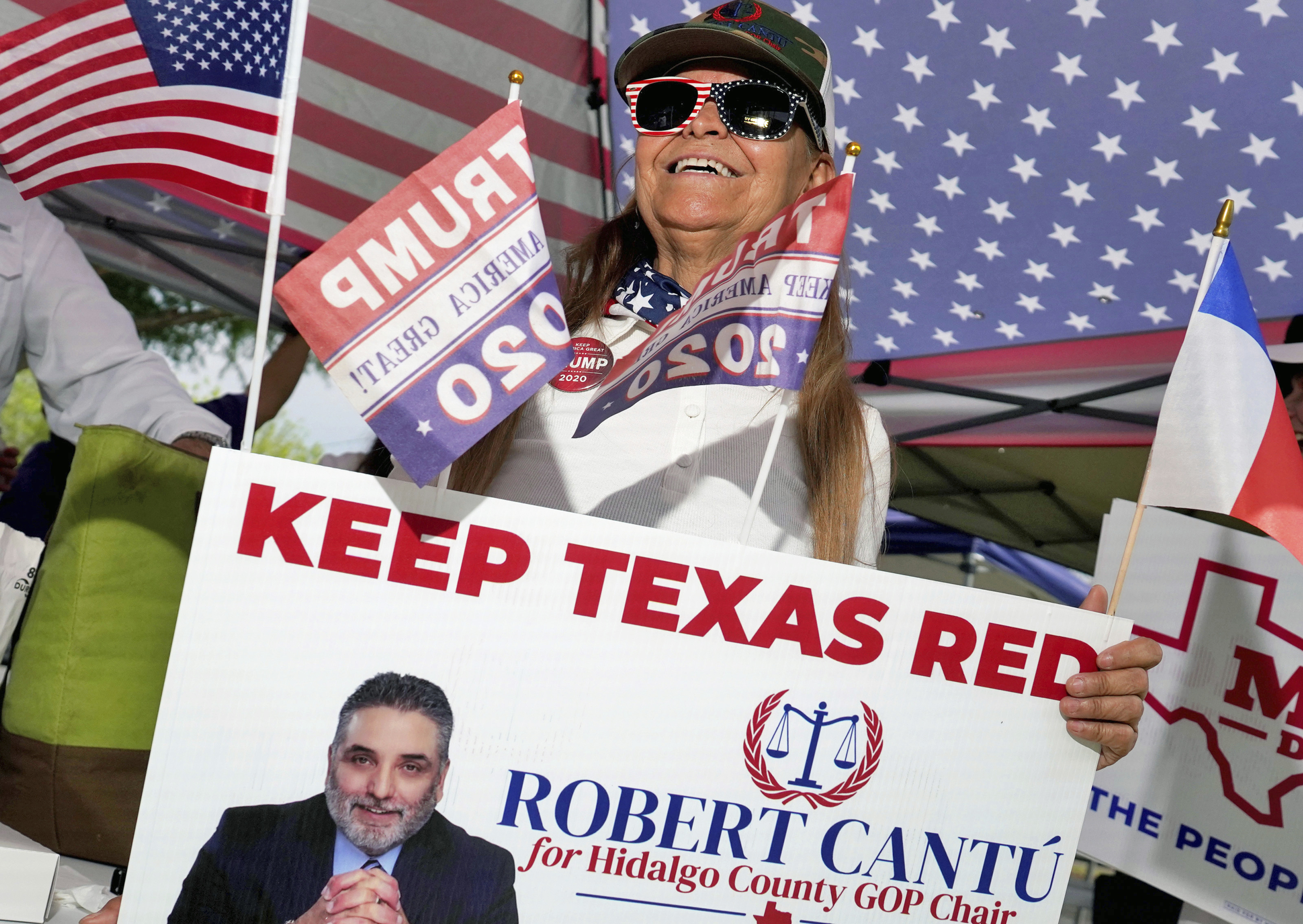 Donald Trump supporter Chriselda Leal stands outside a polling place. Photo / AP