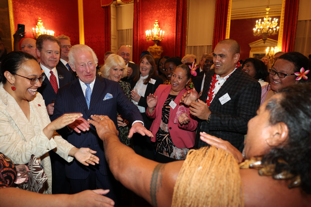 King Charles III reacts alongside Queen Camilla as former Samoan rugby player Freddie Tuilagi dances during a reception to celebrate the Commonwealth diaspora of the United Kingdom, ahead of the Commonwealth Heads of Government Meeting in Samoa, at St. James's Palace on October 2, 2024 in London, England. Photo / Getty Images