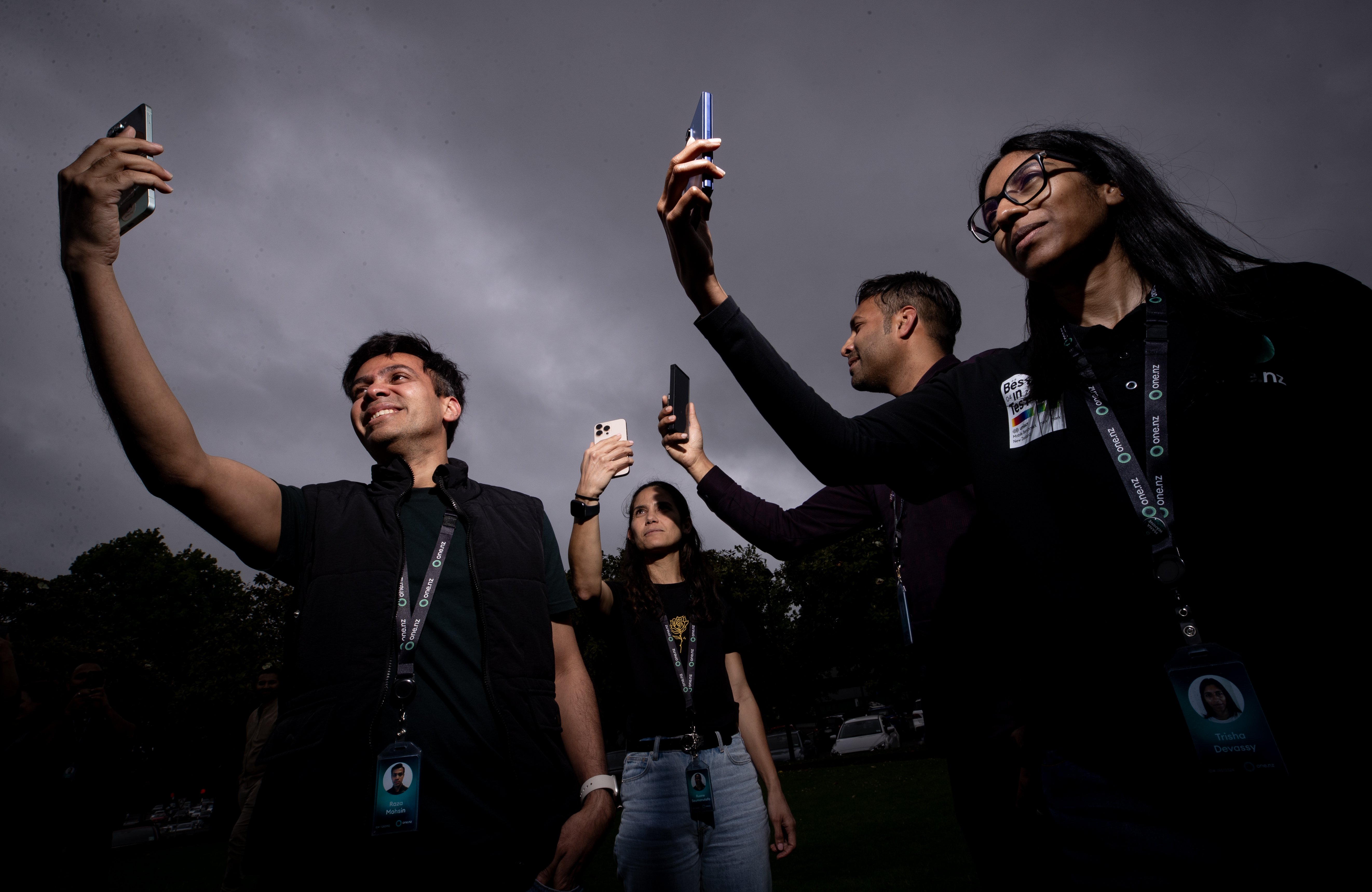 One NZ engineers (L-R) Raza Mohsin, Ruane Seumanutafa, Ahmed Abdul Rahim and Trisha Devassy testing their Direct to Cell partnership with Elon Musk’s Starlink outside One NZ North Shore HQ. Photo / Dean Purcell