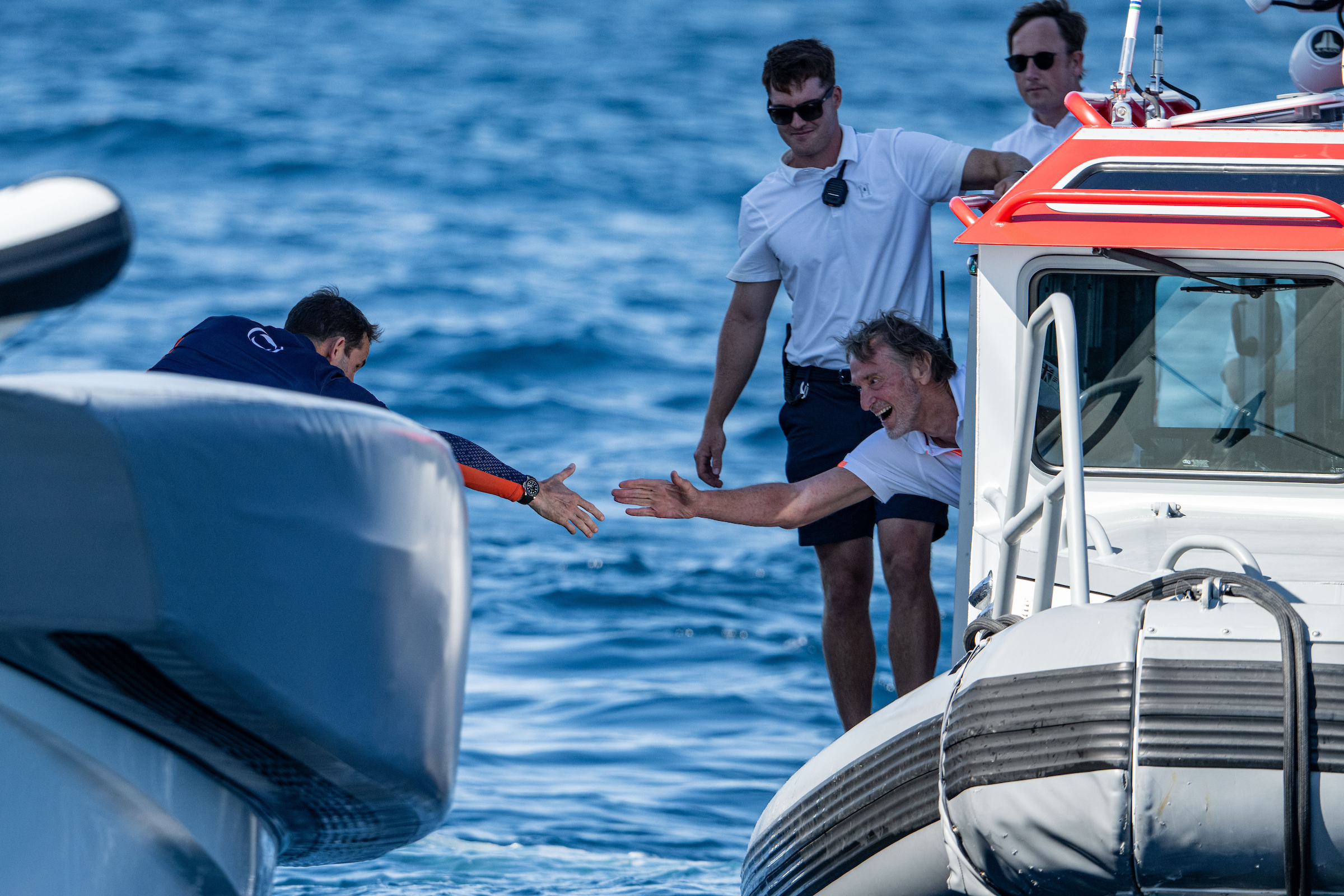 Ineos Britannia helmsman Sir Ben Ainslie (left) is congratulated by Ineos founder Sir Jim Ratcliffe during the challenger series round-robins. Photo / Ricardo Pinto, America's Cup