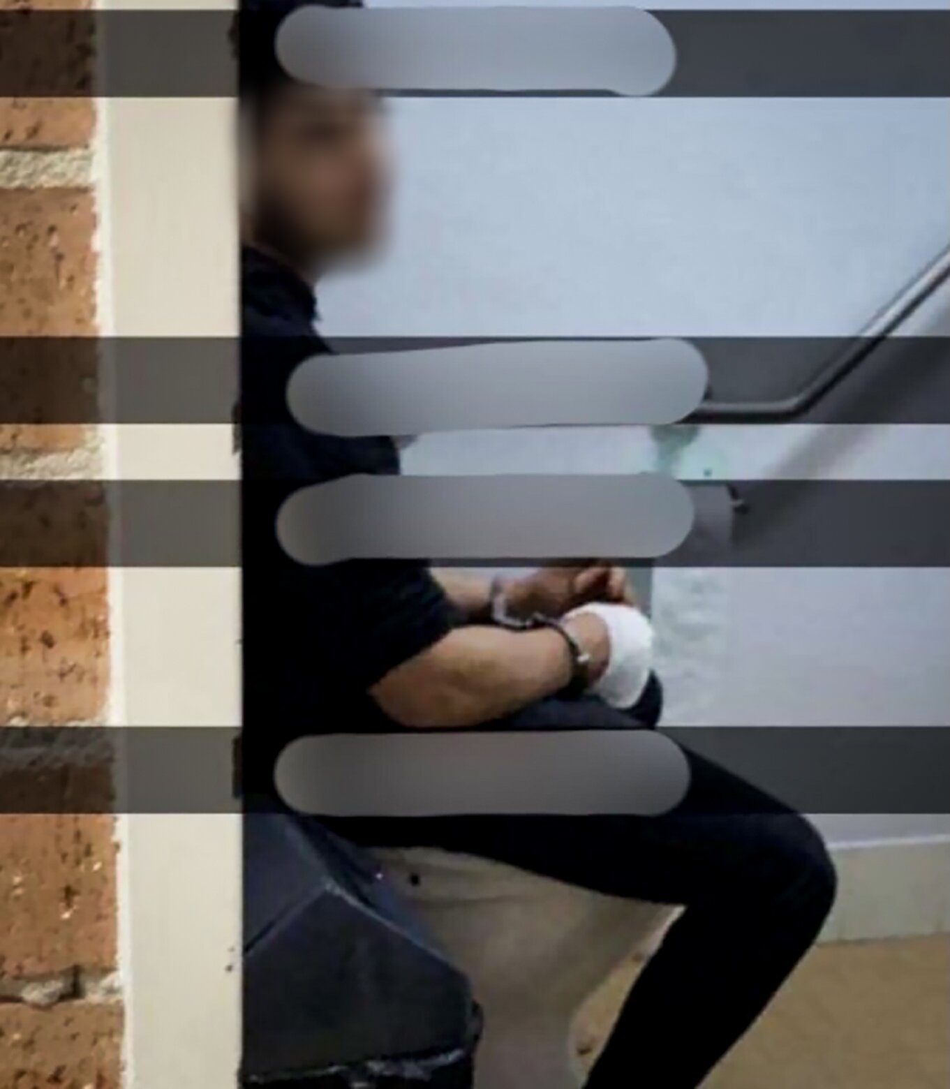 An image circulating on social media shows the Wakeley Church, Sydney, attacker sitting on a toilet with his hand bandaged.