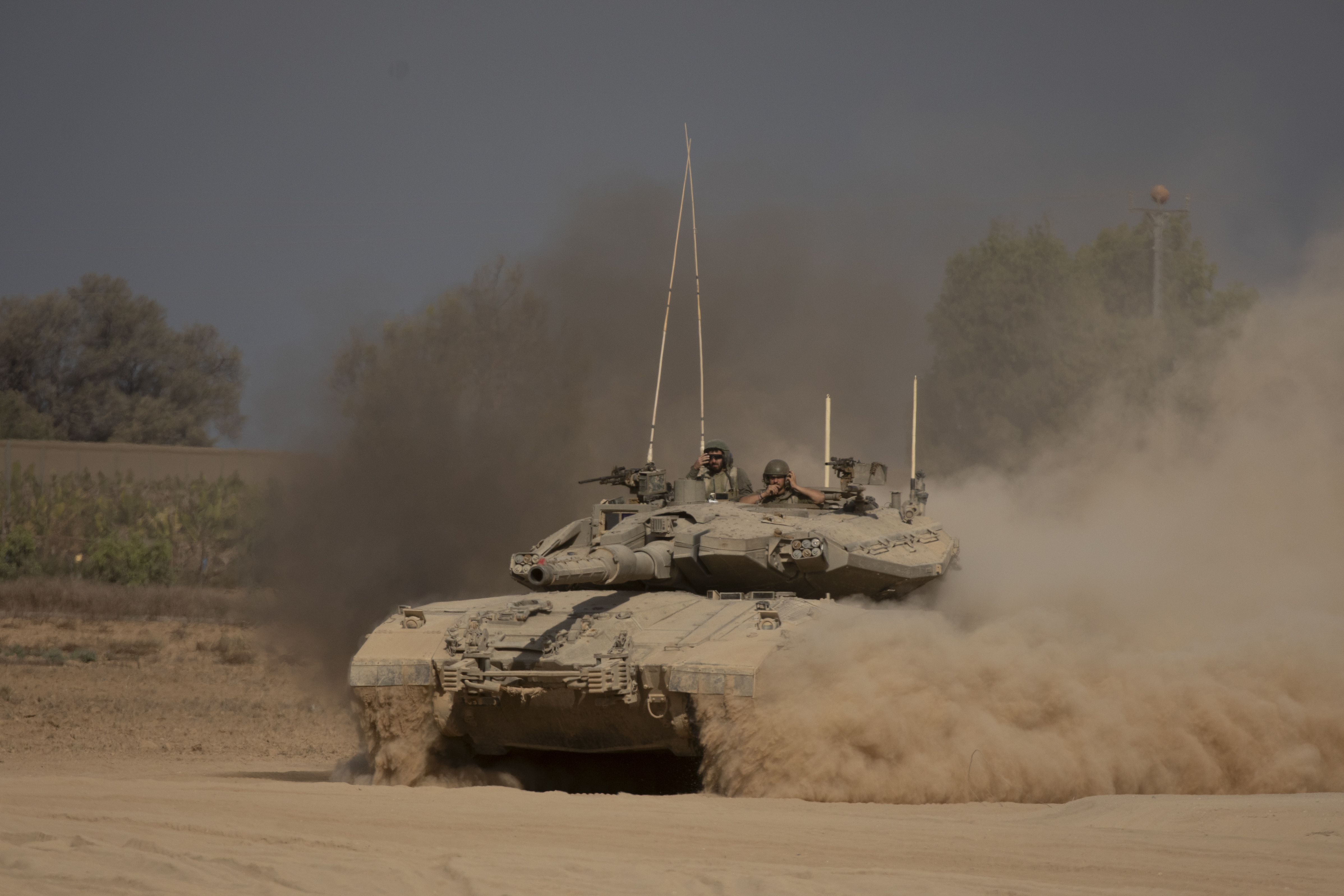 Israeli soldiers stand on a tank as it moves along the Gaza Strip border on August 29, 2024 in southern Israel. Photo / Getty Images