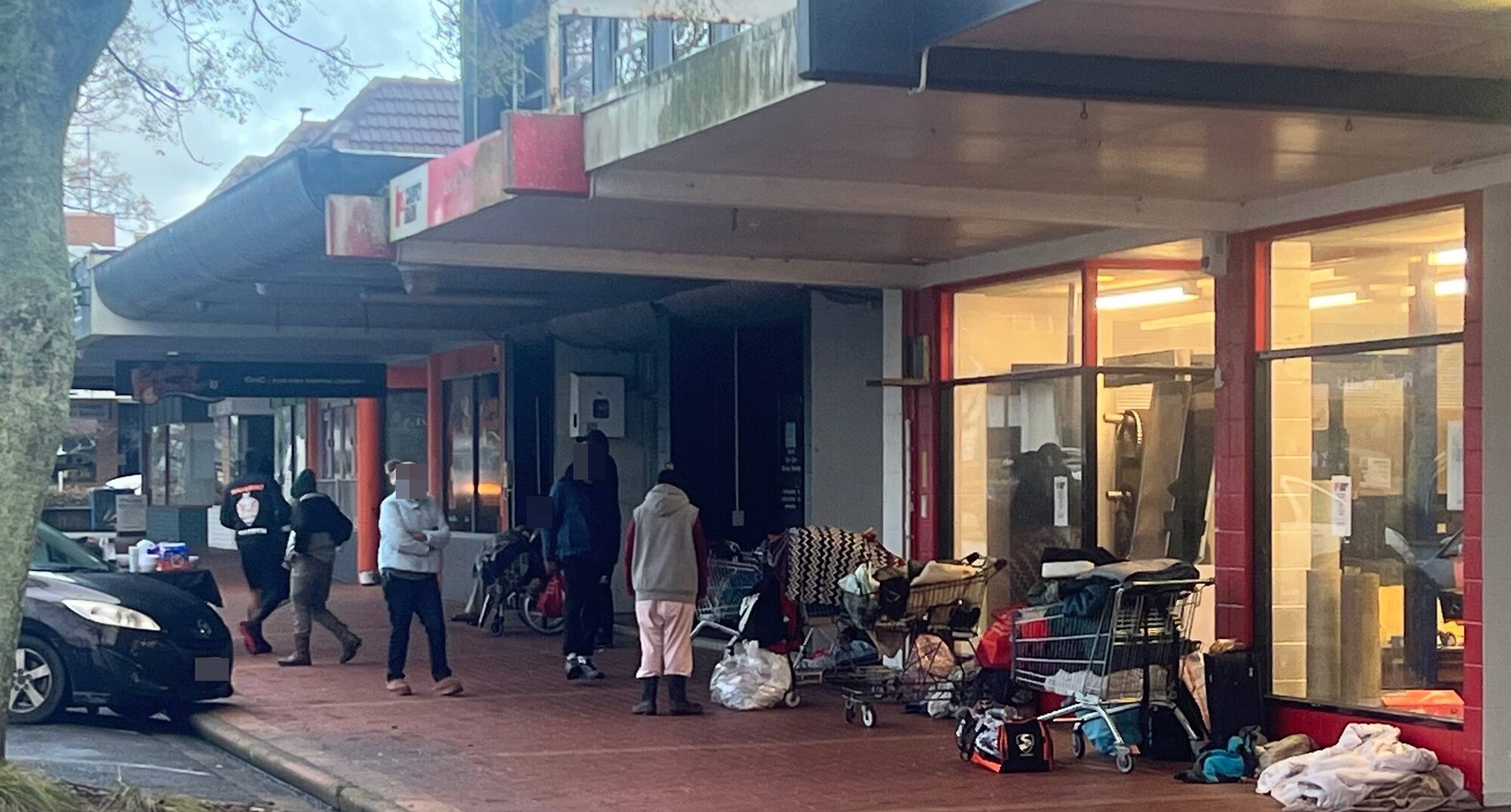 Homeless people and belongings on Pukuatua St this week. Photo / Kelly Makiha