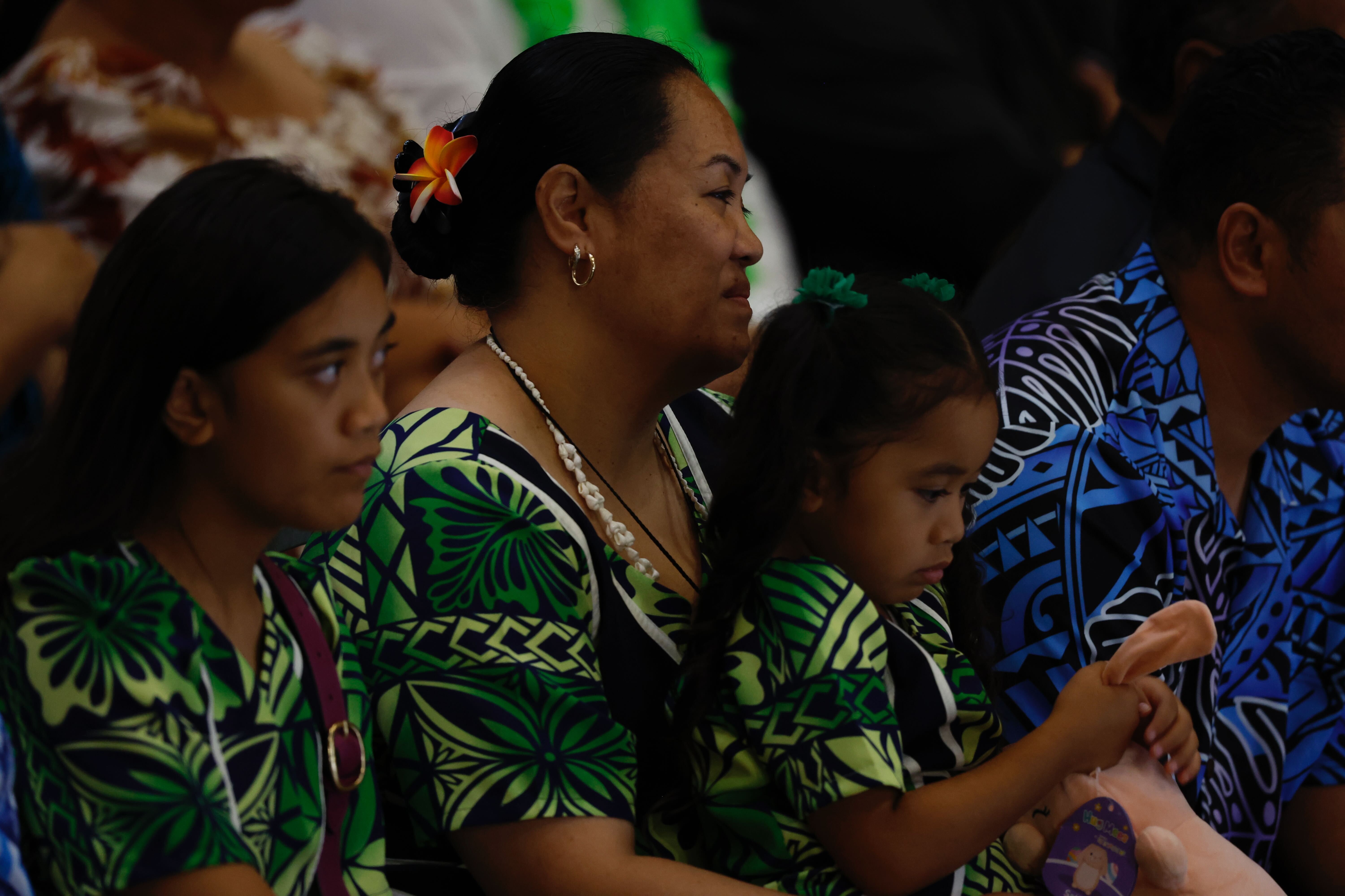 Efeso Collins' wife Fia and daughters Kaperiela and Asalemo. Photo / Michael Craig