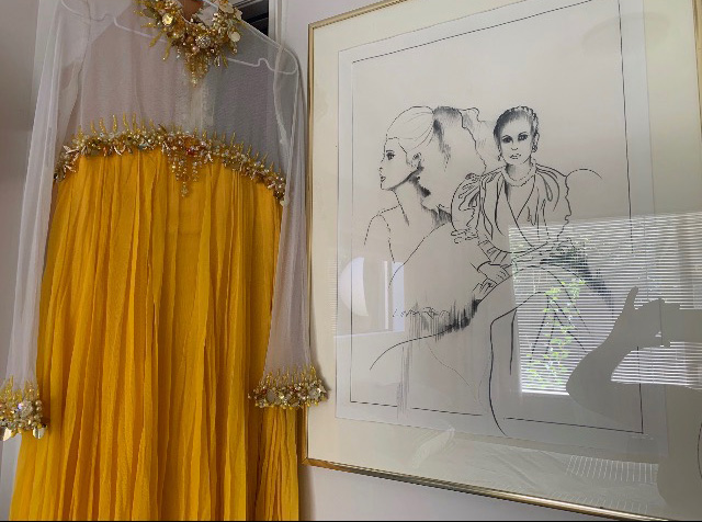 The gown alongside a drawing of Kevin's late wife and business partner Shirley.