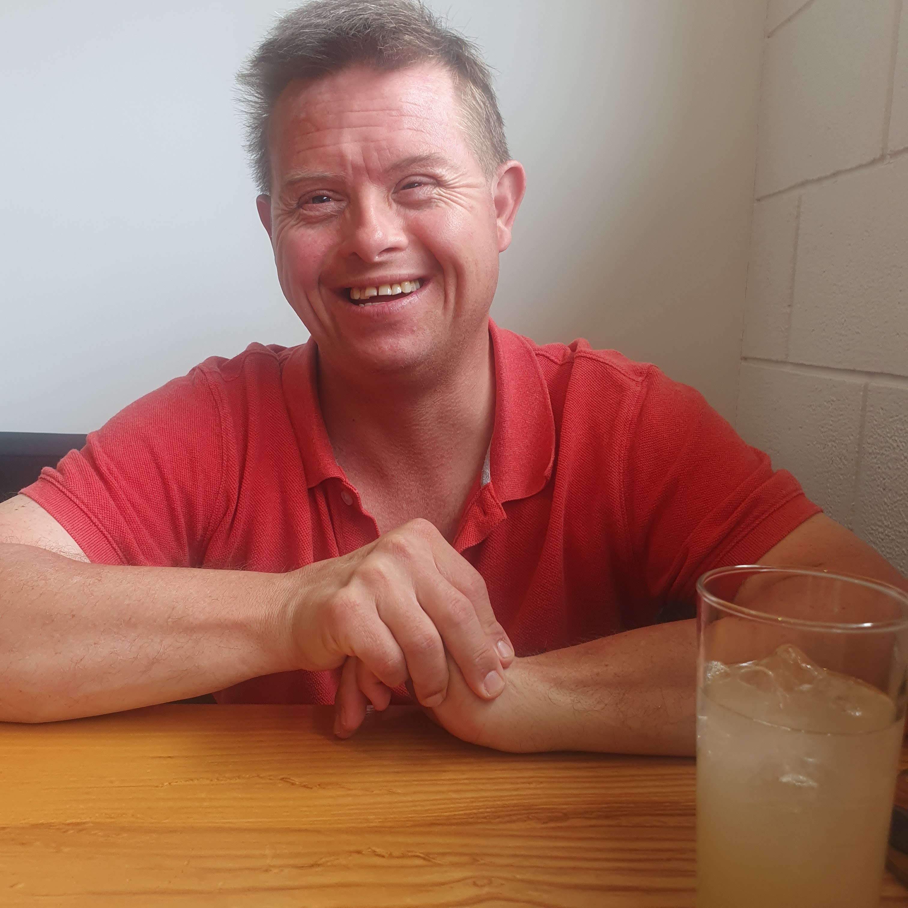 Travers Brown, aged 43, has Down syndrome. His mother, Colleen Brown, says cutbacks to disability support have caused grief and bewilderment among carers.