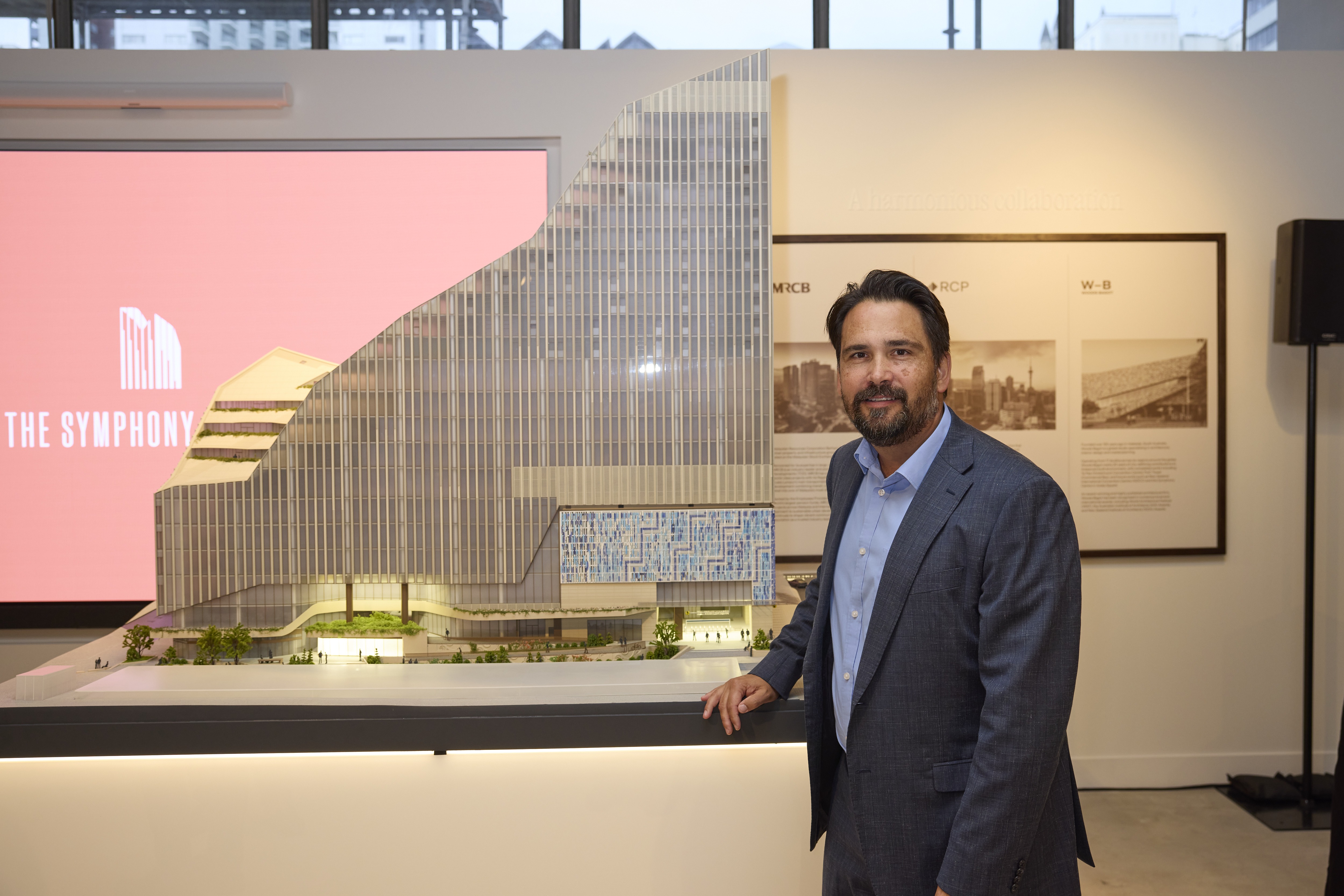 Simon Bridges with a model for the planned Symphony Centre.  Photo / Anupam Singh