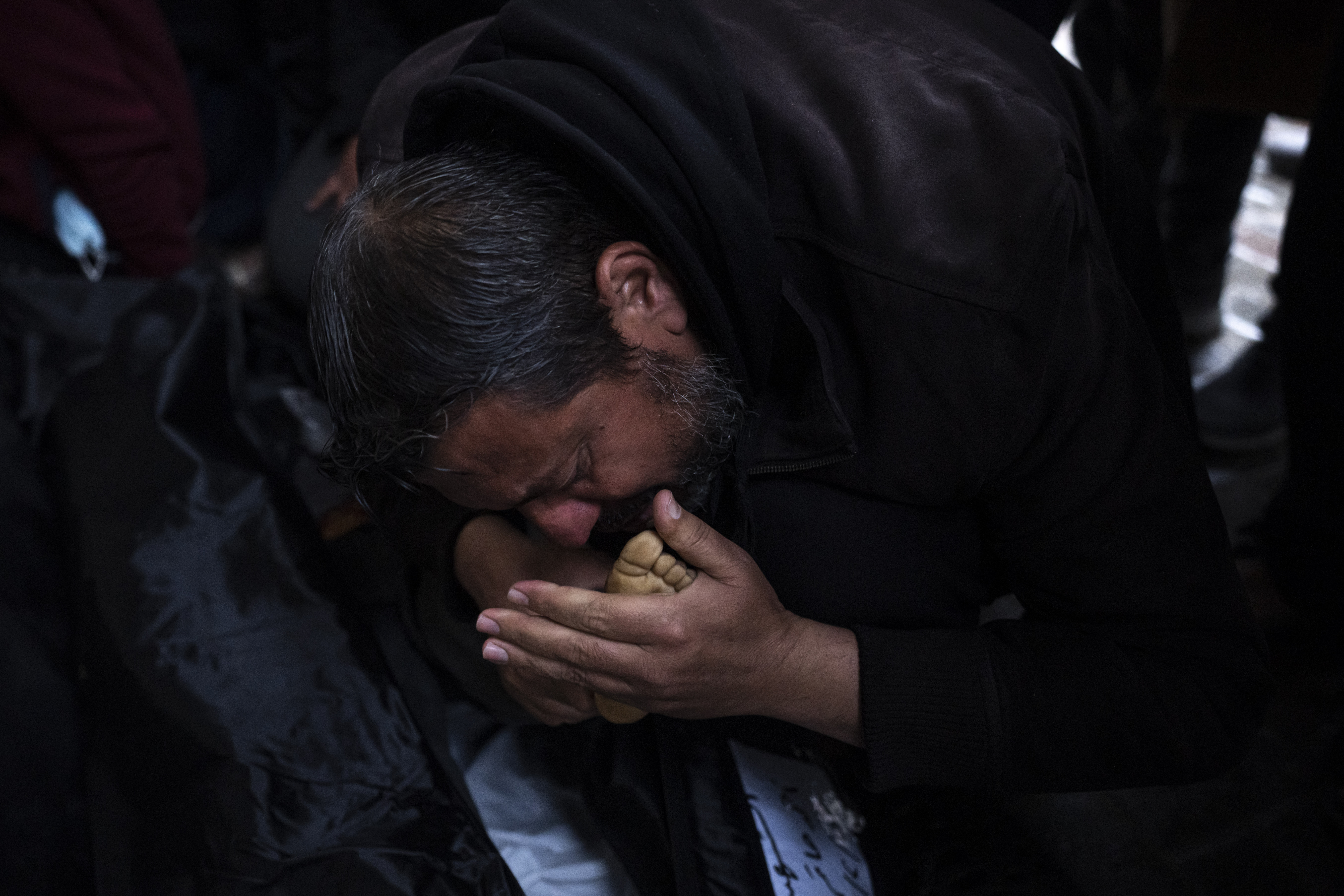 Palestinians mourn relatives, killed in the Israeli bombardment of the Gaza Strip, outside a morgue in Rafah, southern Gaza. Photo / AP