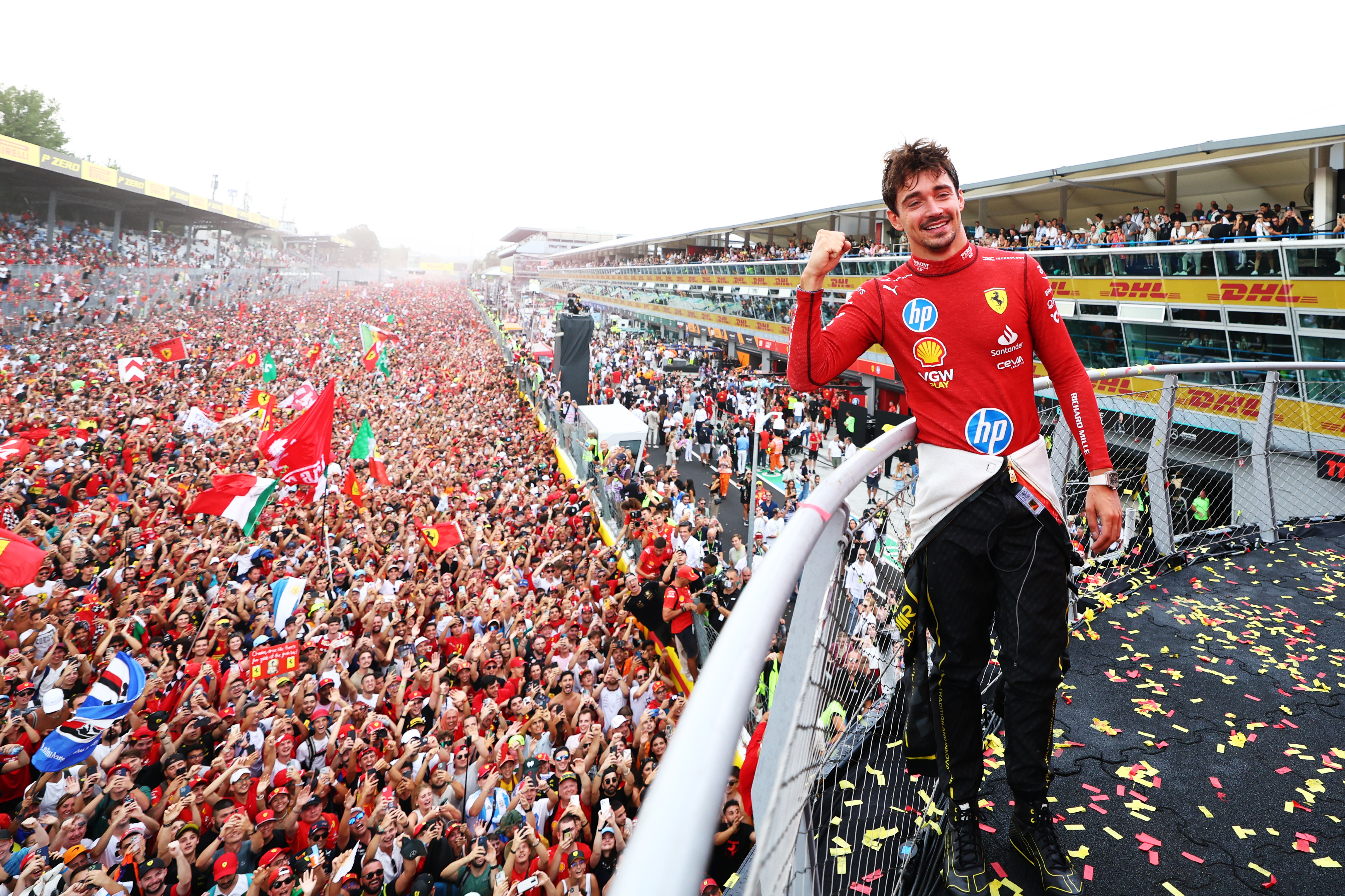 Race winner Charles Leclerc of Ferrari poses for a picture on the podium, with the fans down on the track during the F1 Grand Prix of Italy at Autodromo Nazionale Monza. Photo / Getty Images
