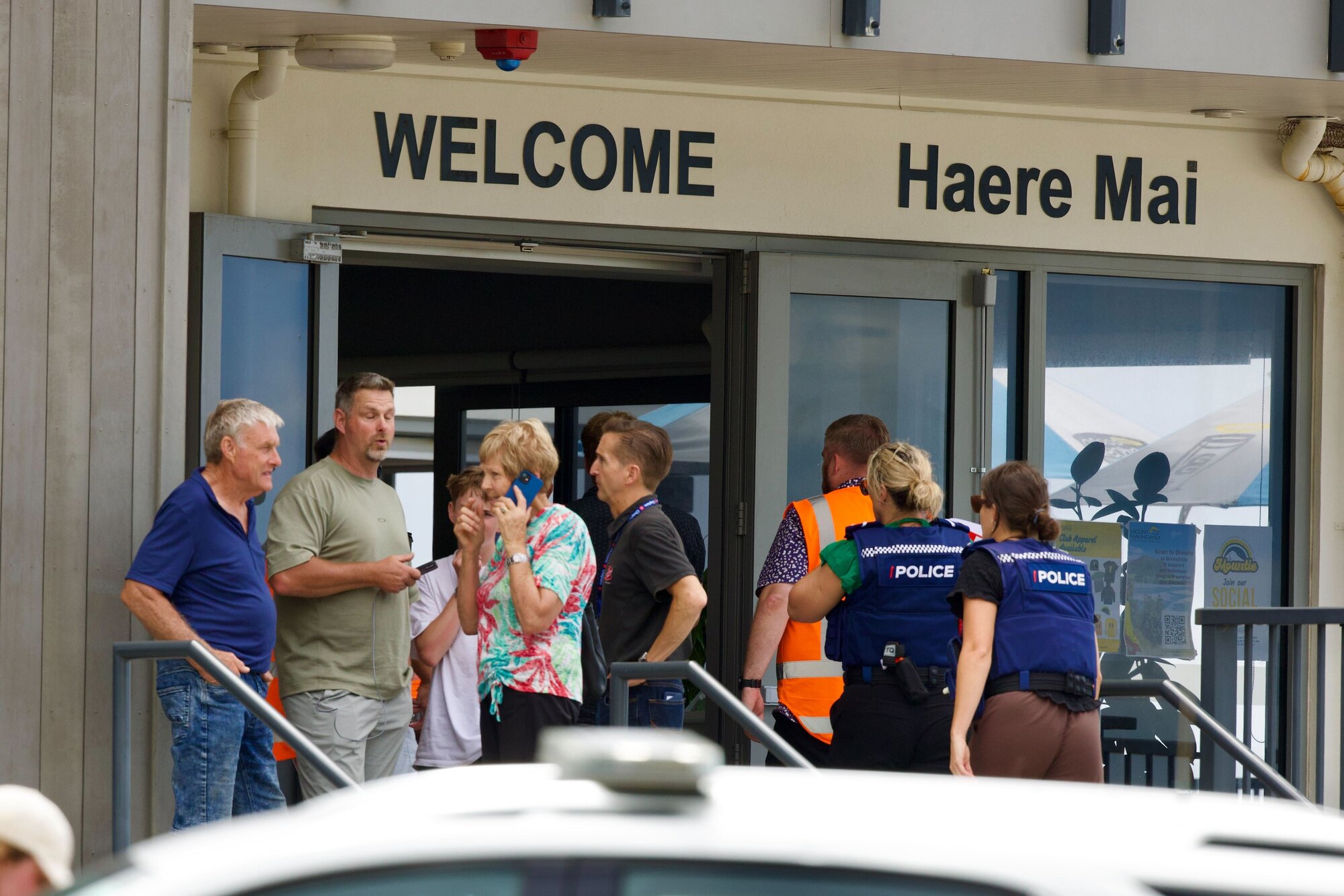 Campers were being interviewed, positioned and staged at the Mount Maunganui Surf Club following a major landslide. Photo / Jason Dorday