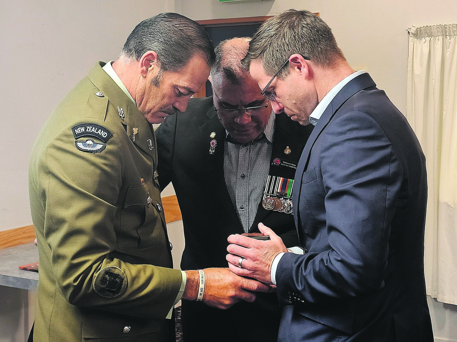  Whakatāne RSA Padre Raharuhi Koia prays as Warrant Officer Willie Apiata entrusts his Victoria Cross medal to Minister for Veterans Chris Penk last year in a bid to improve support for veterans. Photo / Diane McCarthy