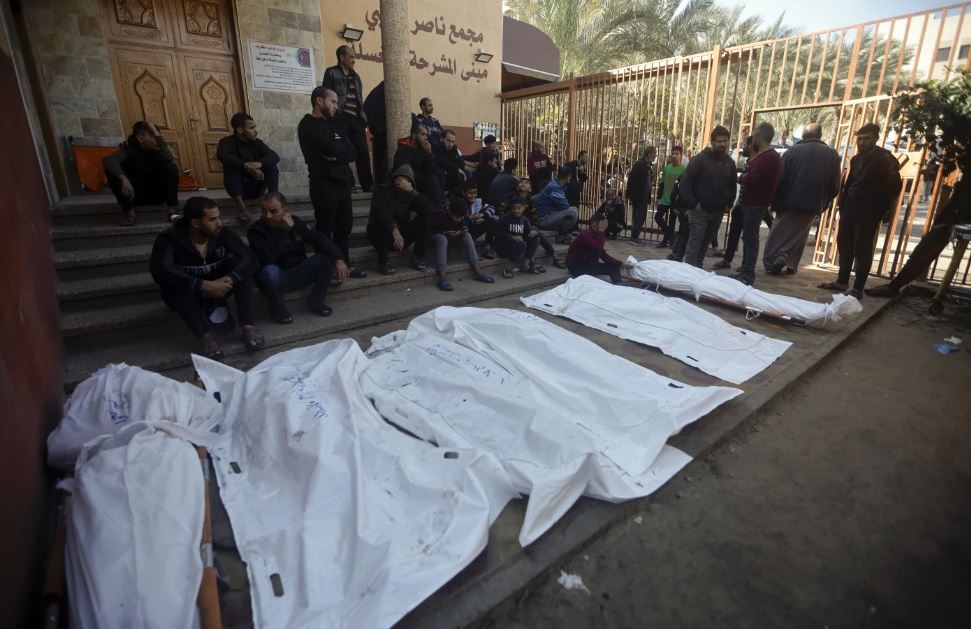 Palestinians mourn relatives killed in the Israeli bombardment of the Gaza Strip outside a morgue in Khan Younis on Friday, December 15. Photo / AP