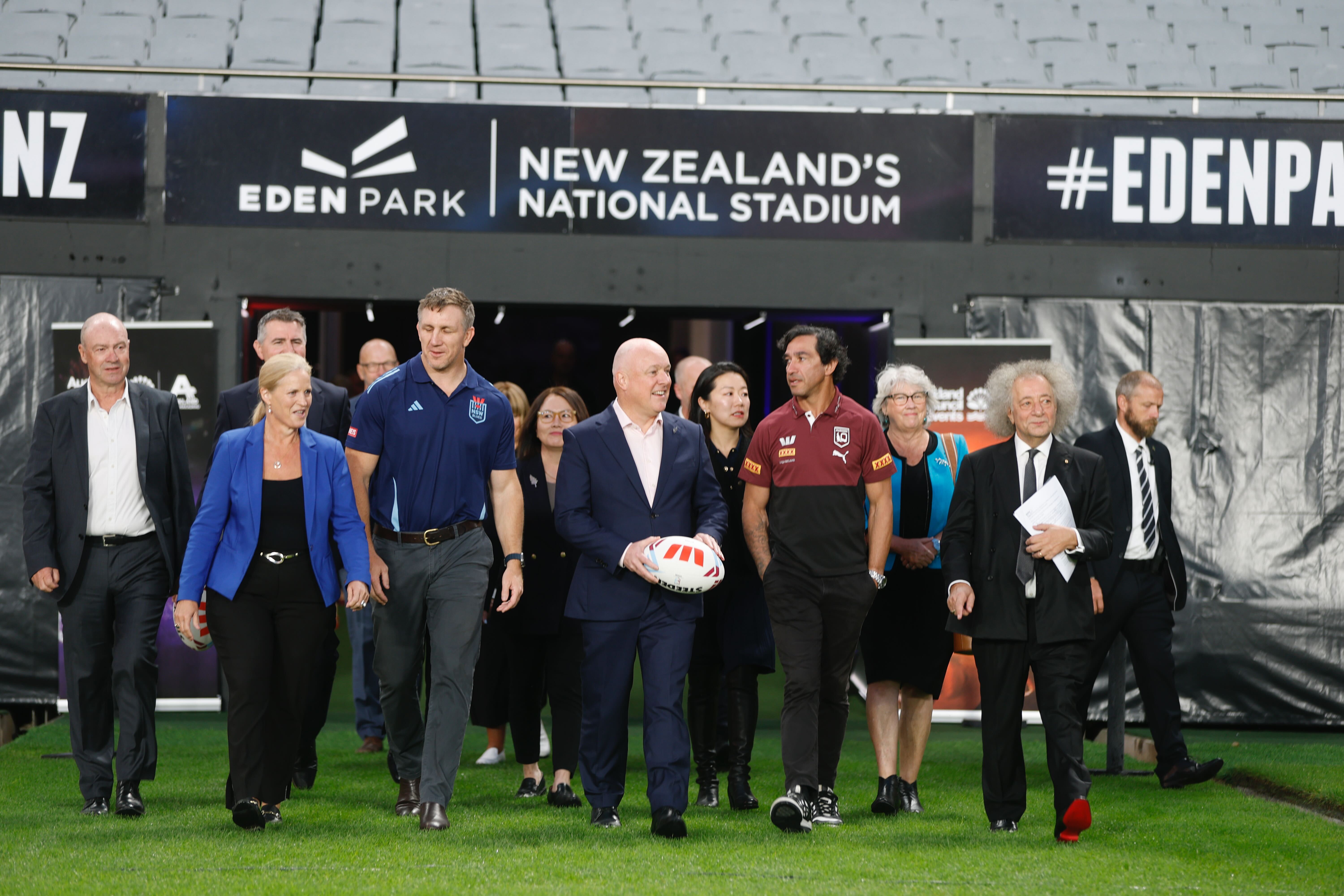Prime Minister Christopher Luxon (centre), joined by Tourism and Hospitality Minister Louise Upston (from front left) and former NRL stars Ryan Hoffman and Johnathan Thurston at Eden Park. Photo / Michael Craig