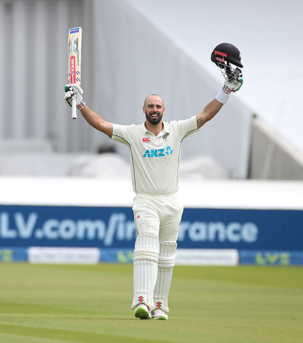 Daryl Mitchell celebrates reaching his century during day three of the first test against England in 2022. Photo / Photosport