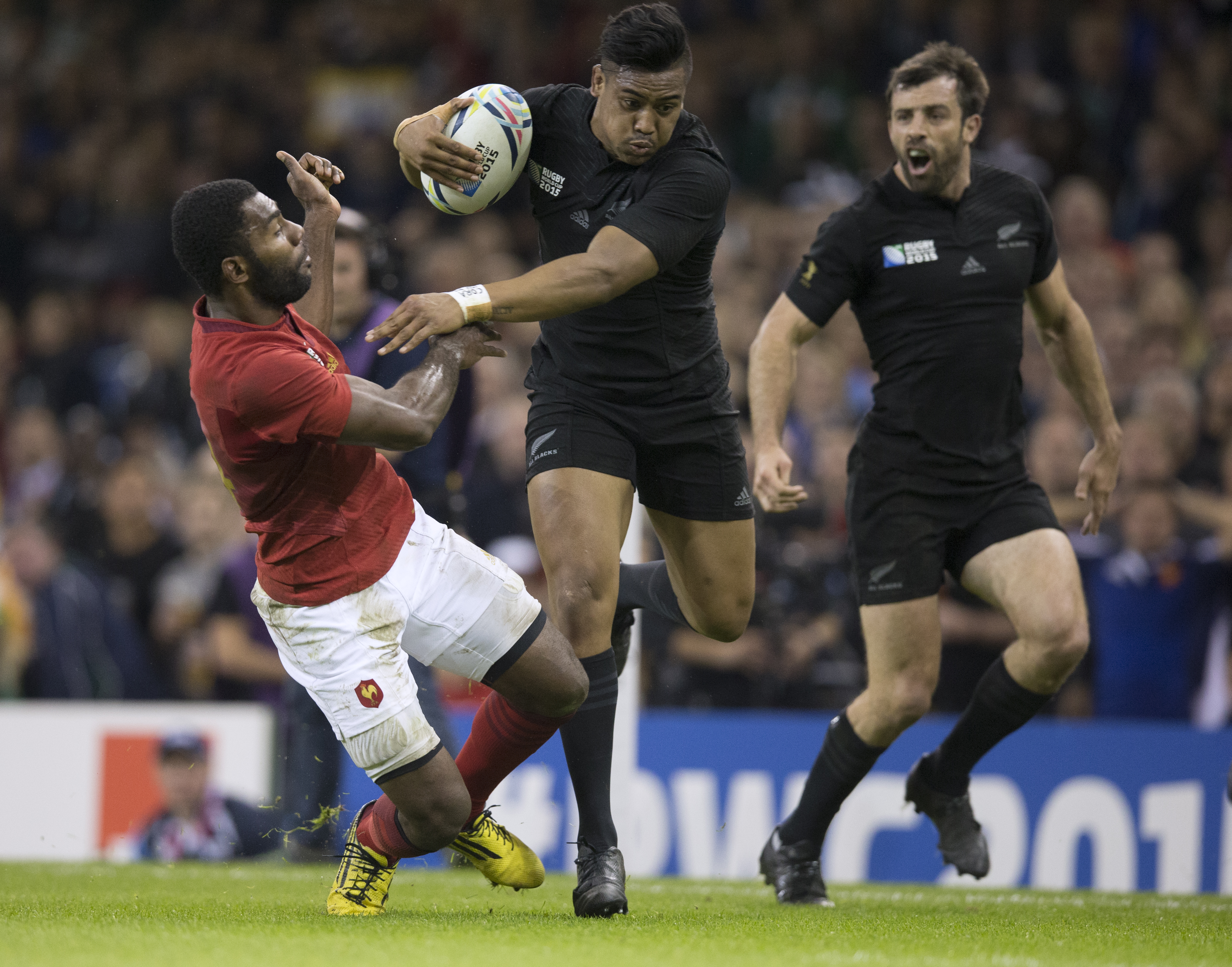Julian Savea on his way to a try during the 2015 quarter-final between France and the All Blacks. Photo / Brett Phibbs.