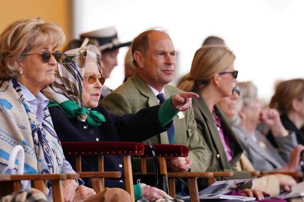 Queen Elizabeth II is joined by Prince Edward and Sophie, right, the Earl and Countess of Wessex as they sit in the Royal Box at the Royal Windsor Horse Show. Photo / AP