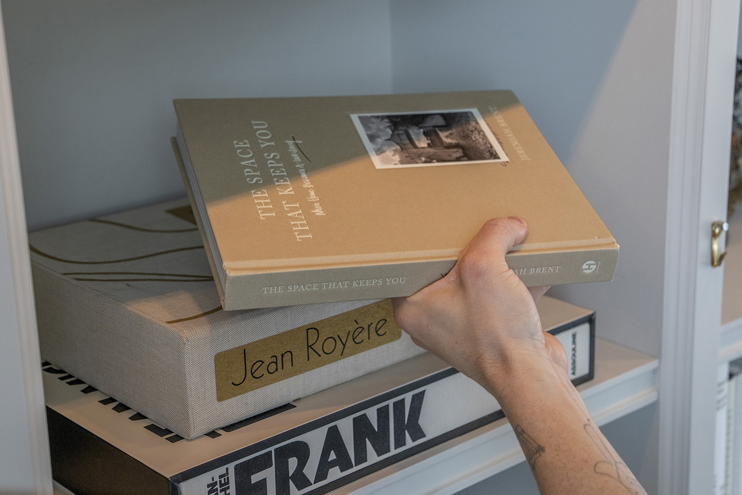 Start by choosing books with attractive covers, and use coordinated colours within individual stacks. Photo / Tony Cenicola, The New York Times