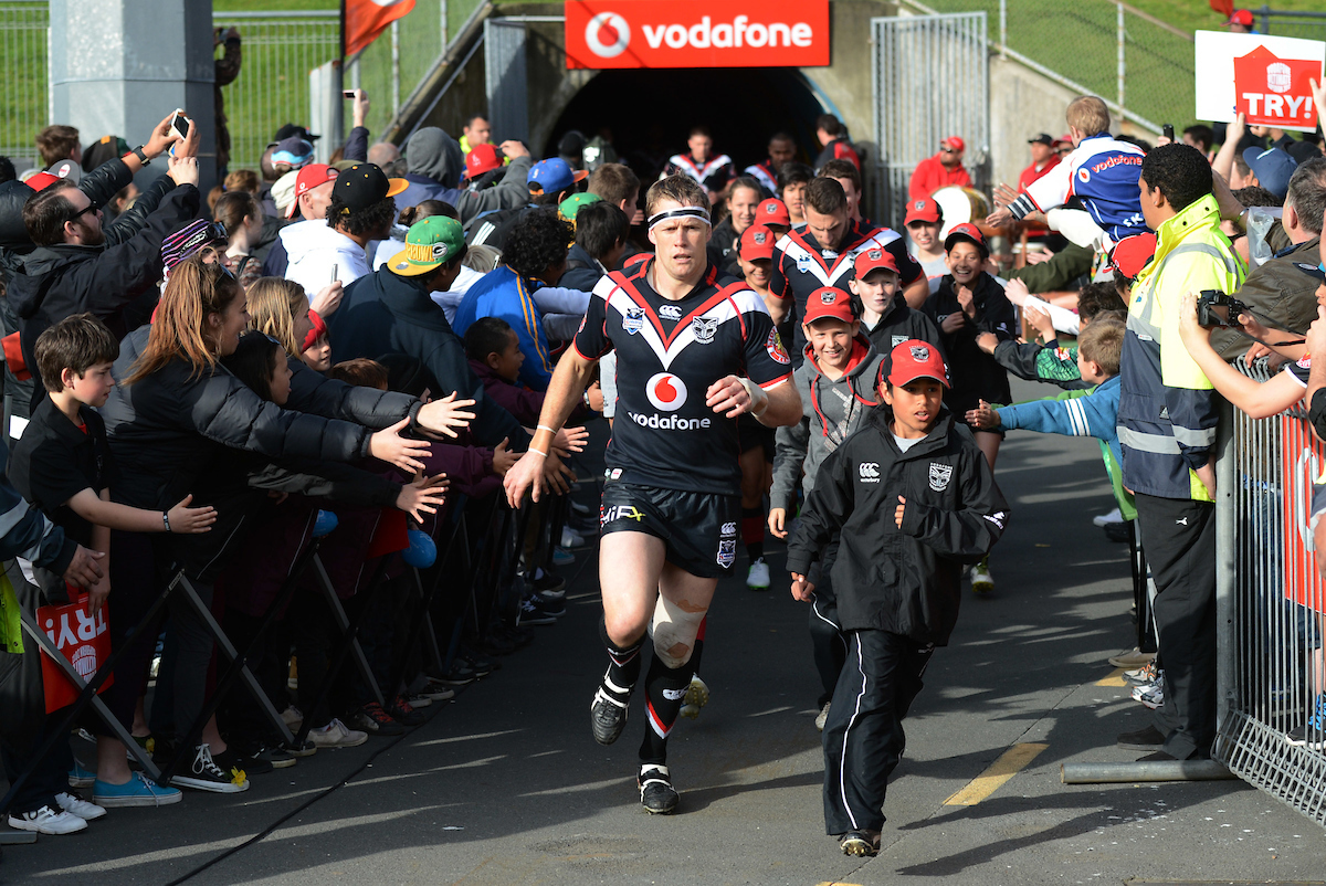 Micheal Luck leads the team onto the field for his last game in the 2012 season. Photo / Photosport