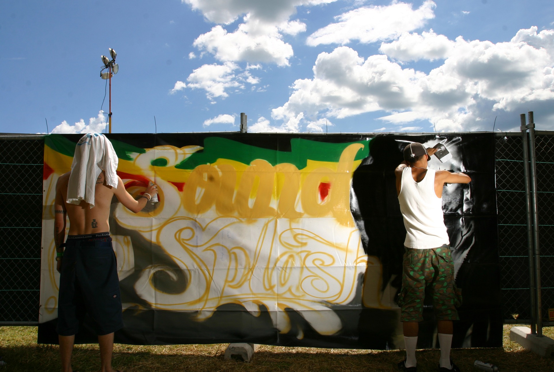 Artists working on a banner at the Raglan SoundSplash Festival in 2007. Photo / NZME