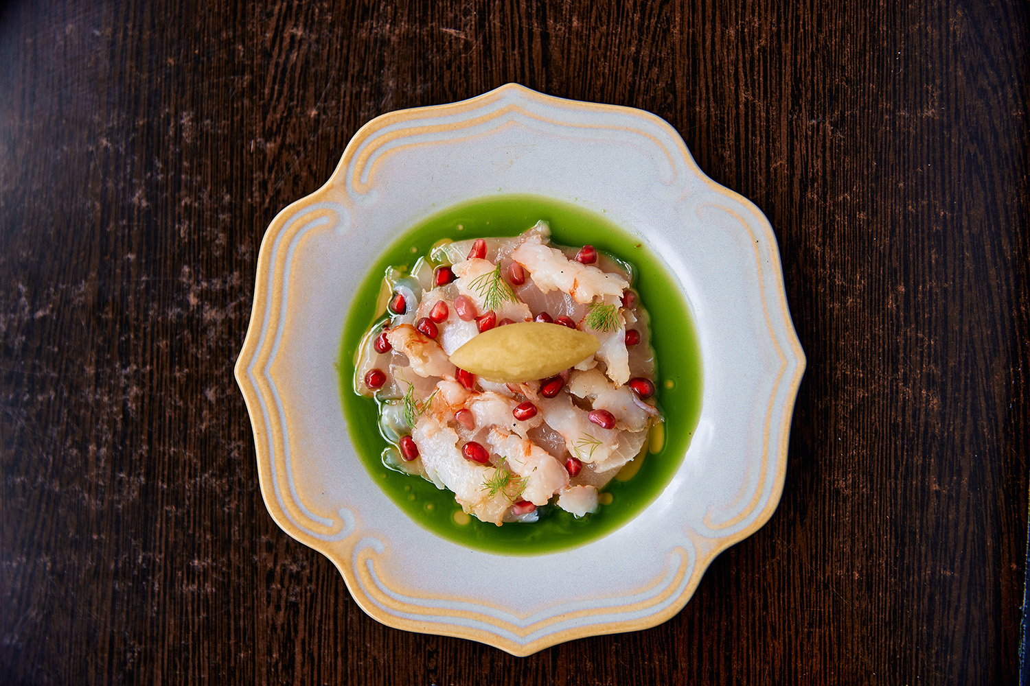 The pescado carpaccio with charred nobashi prawn, pickled pomegranate, jalapeno, coriander and lime sorbet. Photo / Babiche Martens