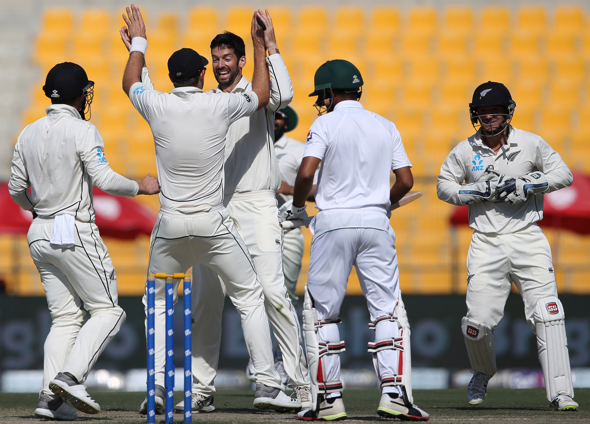 New Zealand players celebrate the dismissal of Pakistan's Asad Shafiq in their test match in Abu Dhabi, United Arab Emirates, Friday, Dec. 7, 2018. (AP Photo/Kamran Jebreili)