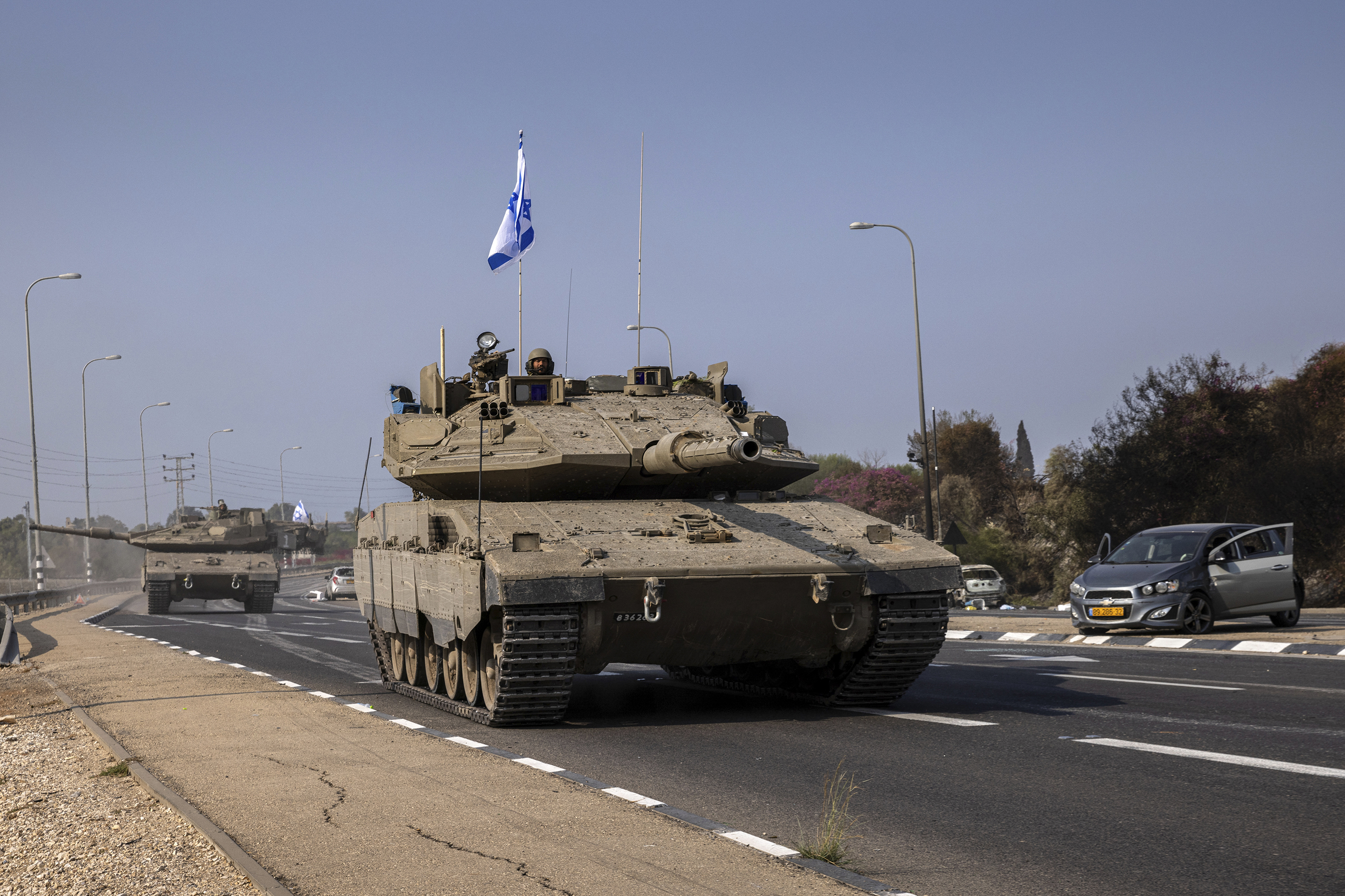Israeli tanks, on their way to the border with Gaza on Sunday, passed through an area in Sderot that had been attacked by Hamas gunmen. Photo / Tamir Kalifa, The New York Times