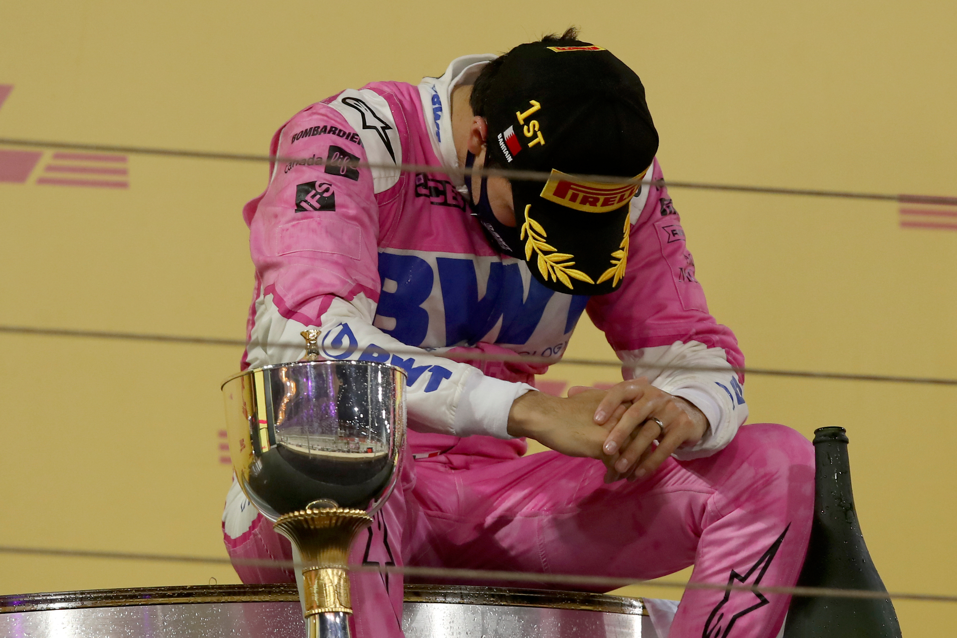 Racing Point driver Sergio Perez of Mexico takes a moment on the podium after wining the Formula One Bahrain Grand Prix in Sakhir. Photo / AP