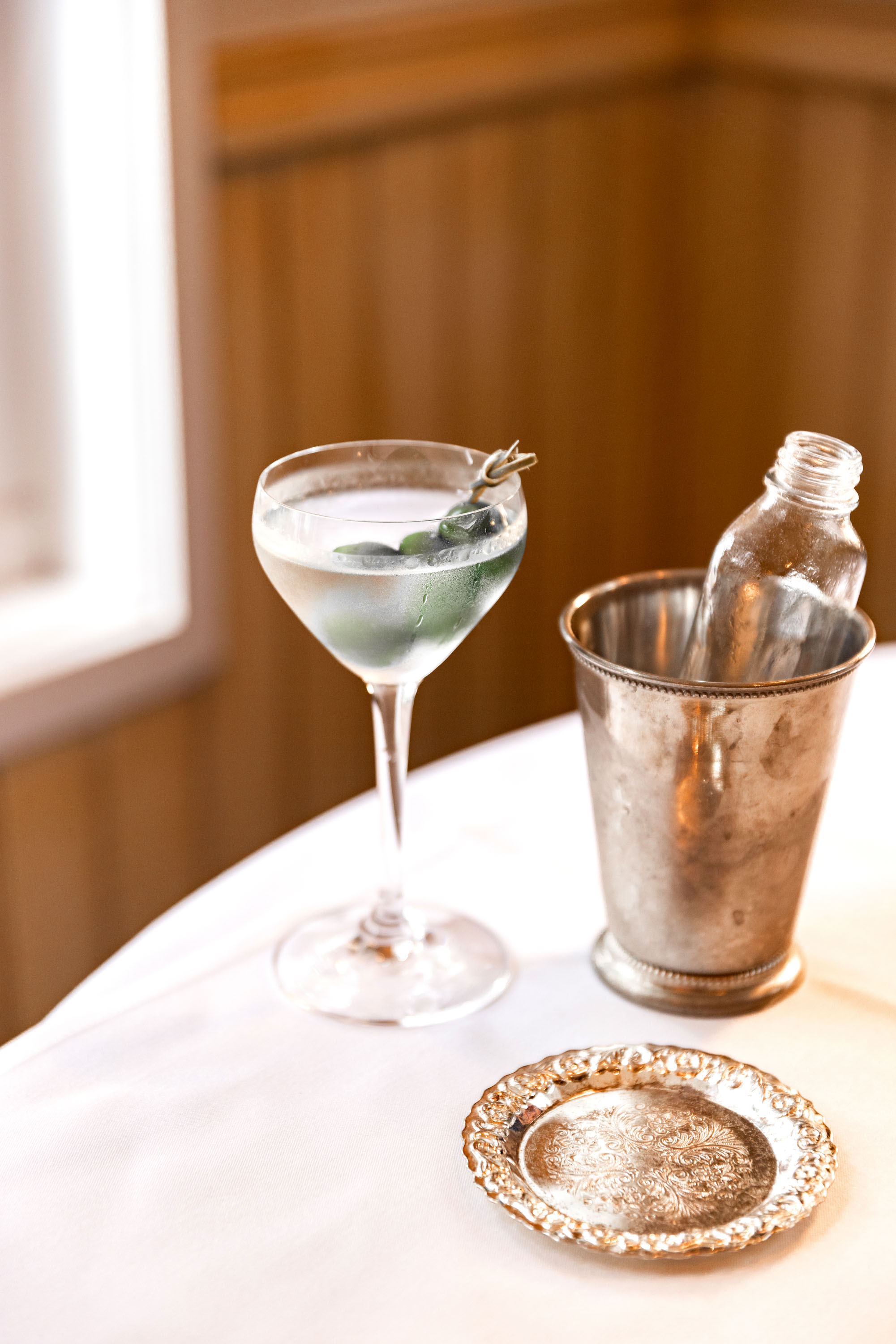 The martini at Wellington's Boulcott Street Bistro is served with a pewter dish and a flask of additional liquid. Photo / Babiche Martens