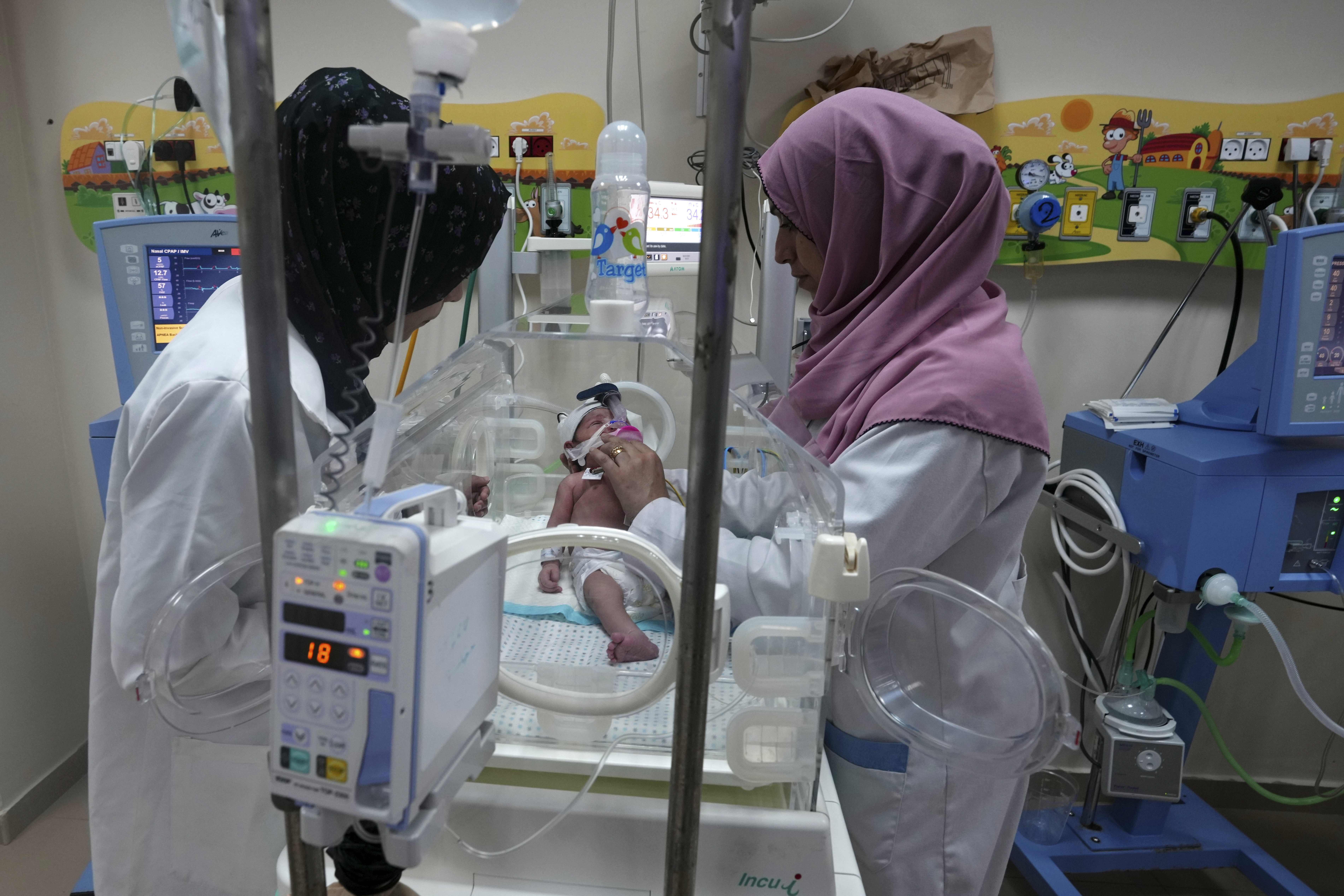 Palestinian doctors treat a prematurely born baby at Al Aqsa Hospital in Deir el-Balah, Gaza Strip. Photo / AP