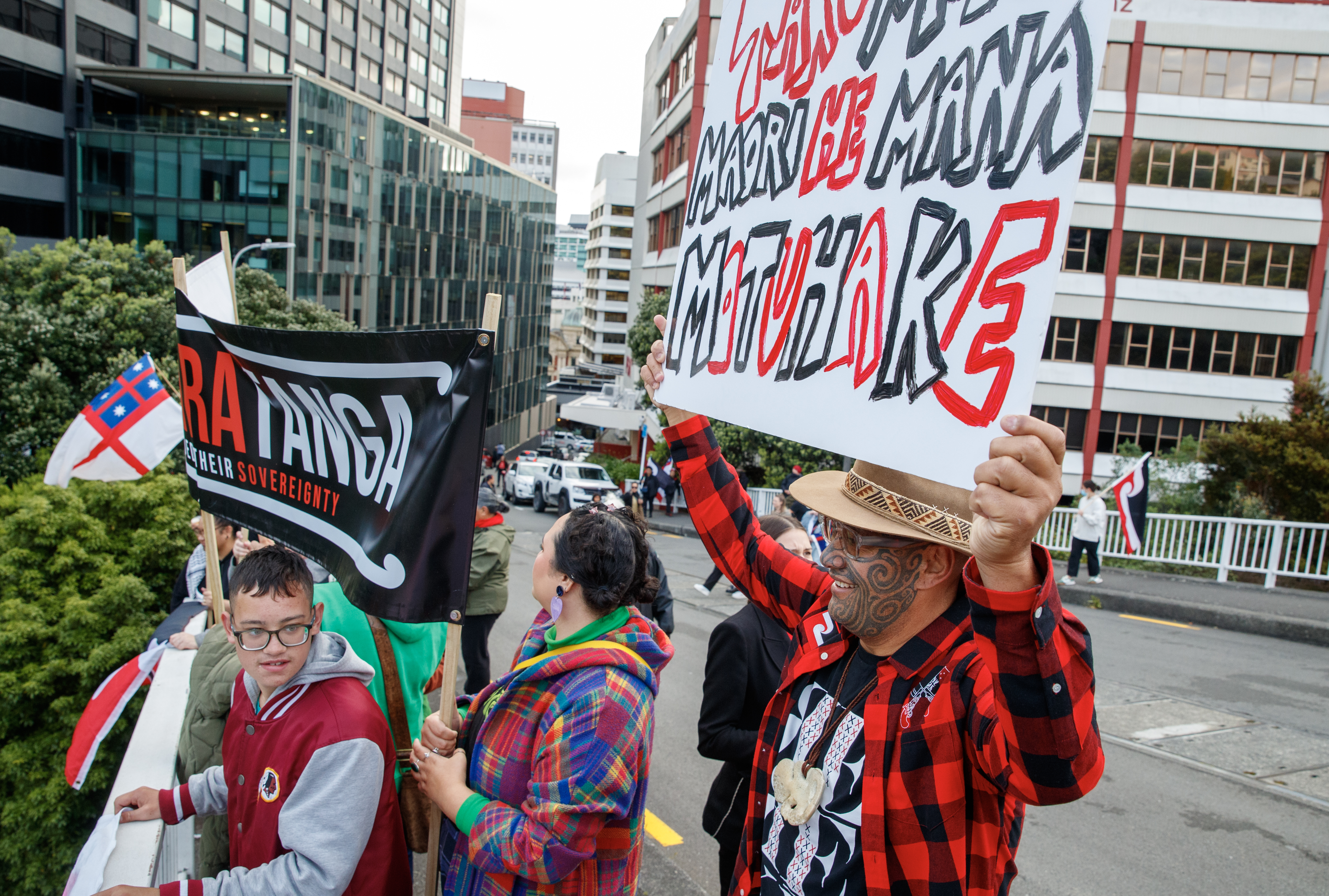 Māori Party co-leader Rawiri Waititi with protesters on the Aurora Terrace bridge in Wellington.