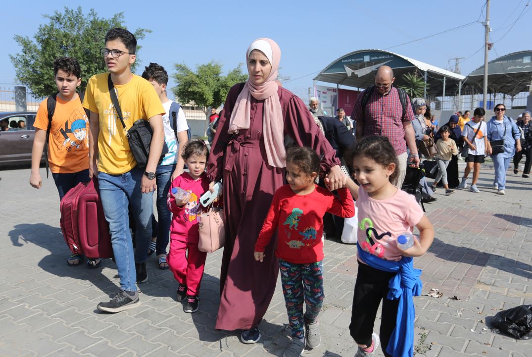 Palestinians cross to the Egyptian side of the border crossing with the Gaza Strip in Rafah. Photo / AP