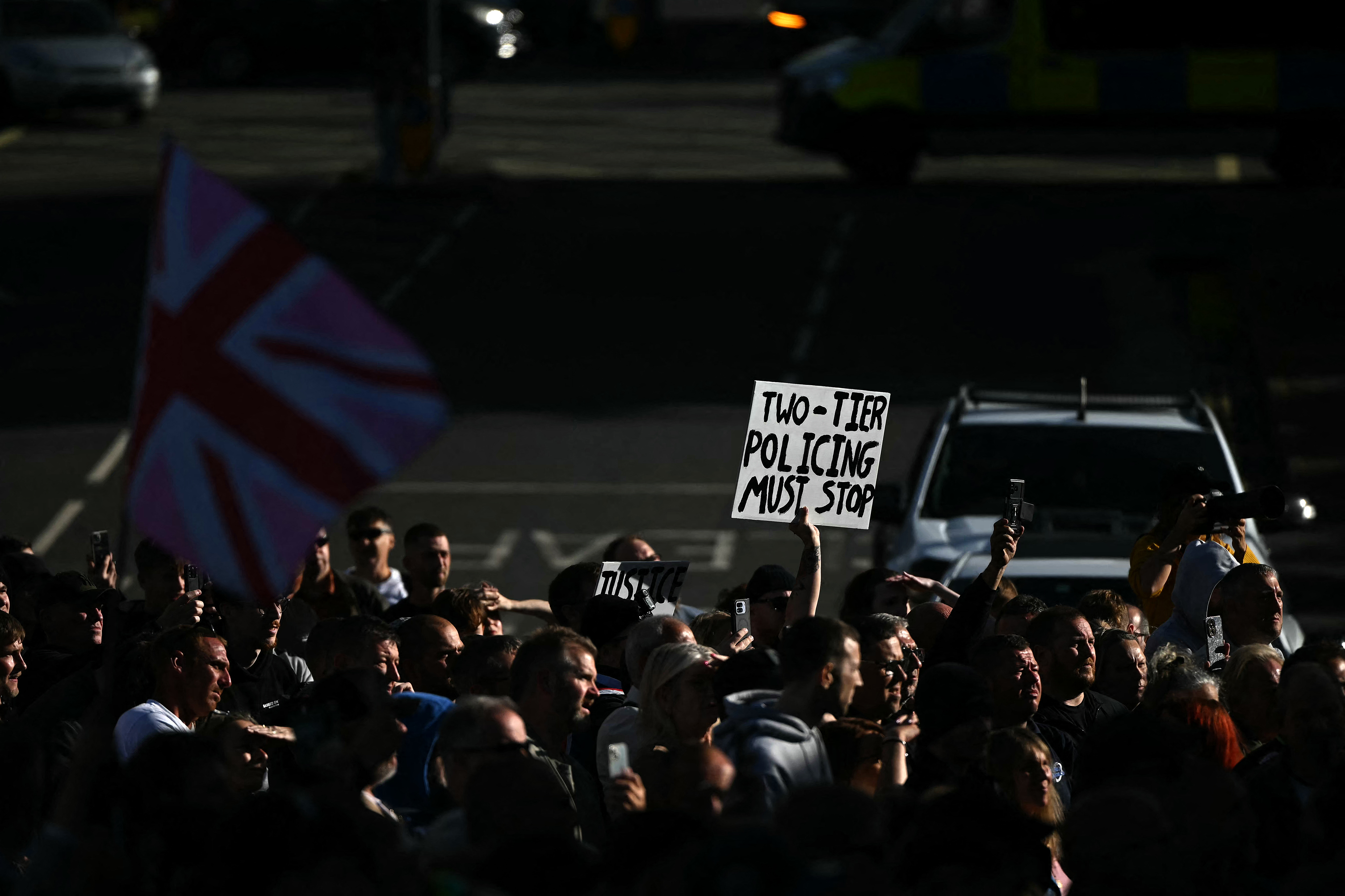 Demonstrators protest about the police's handling of the detention of victim Henry Nowak. Photo / Justin Tallis, AFP