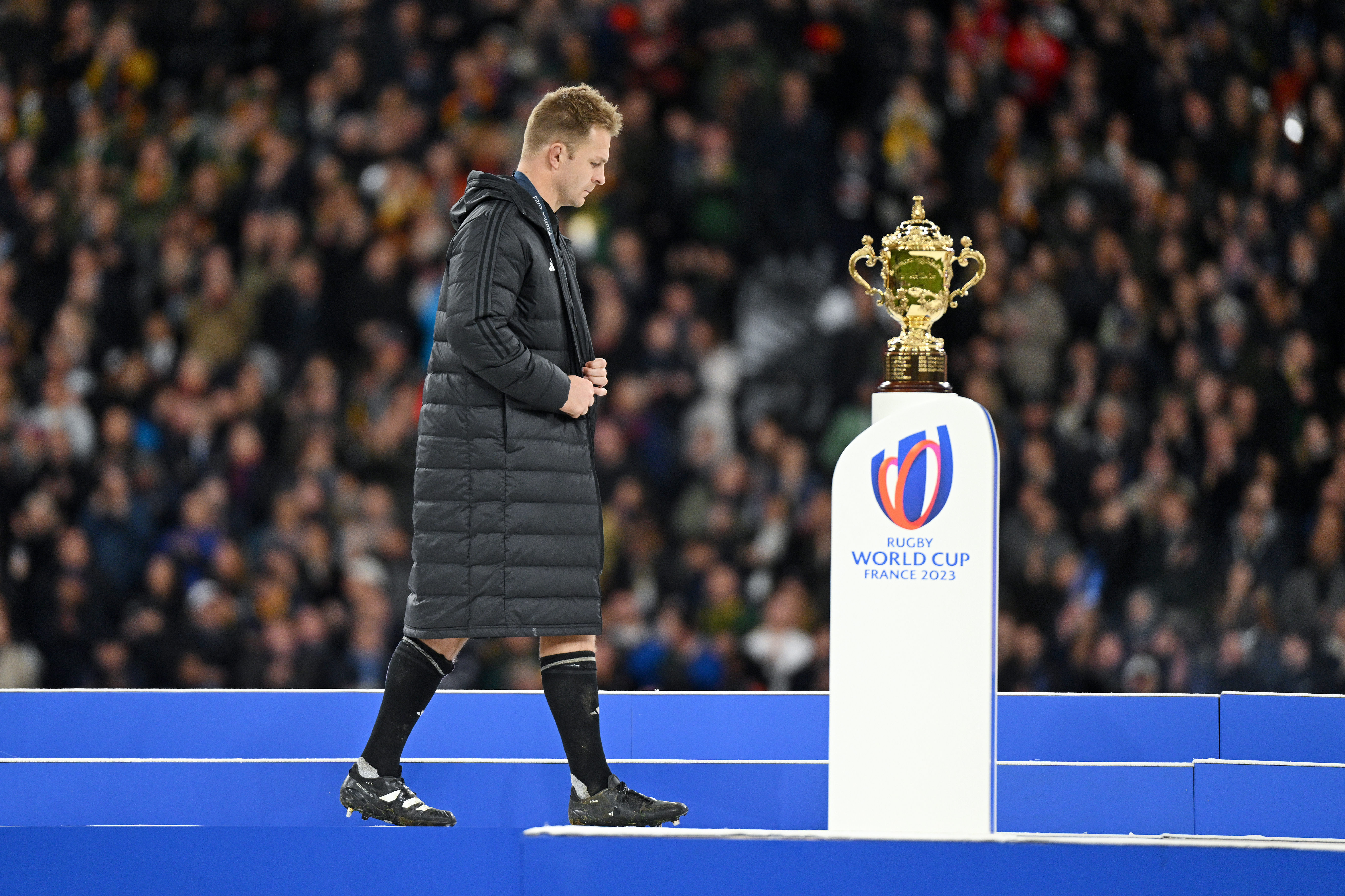 Sam Cane walks by the Rugby World Cup trophy after losing the final to South Africa. Photo / Getty Images