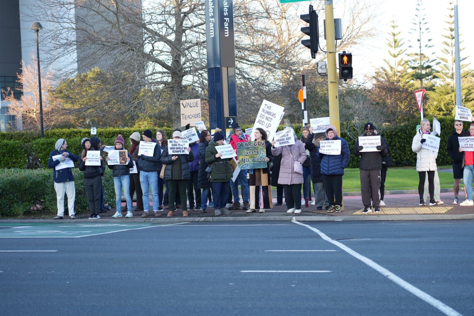 Teachers hold placards outside Westlake Girls' High School on Auckland's North Shore.