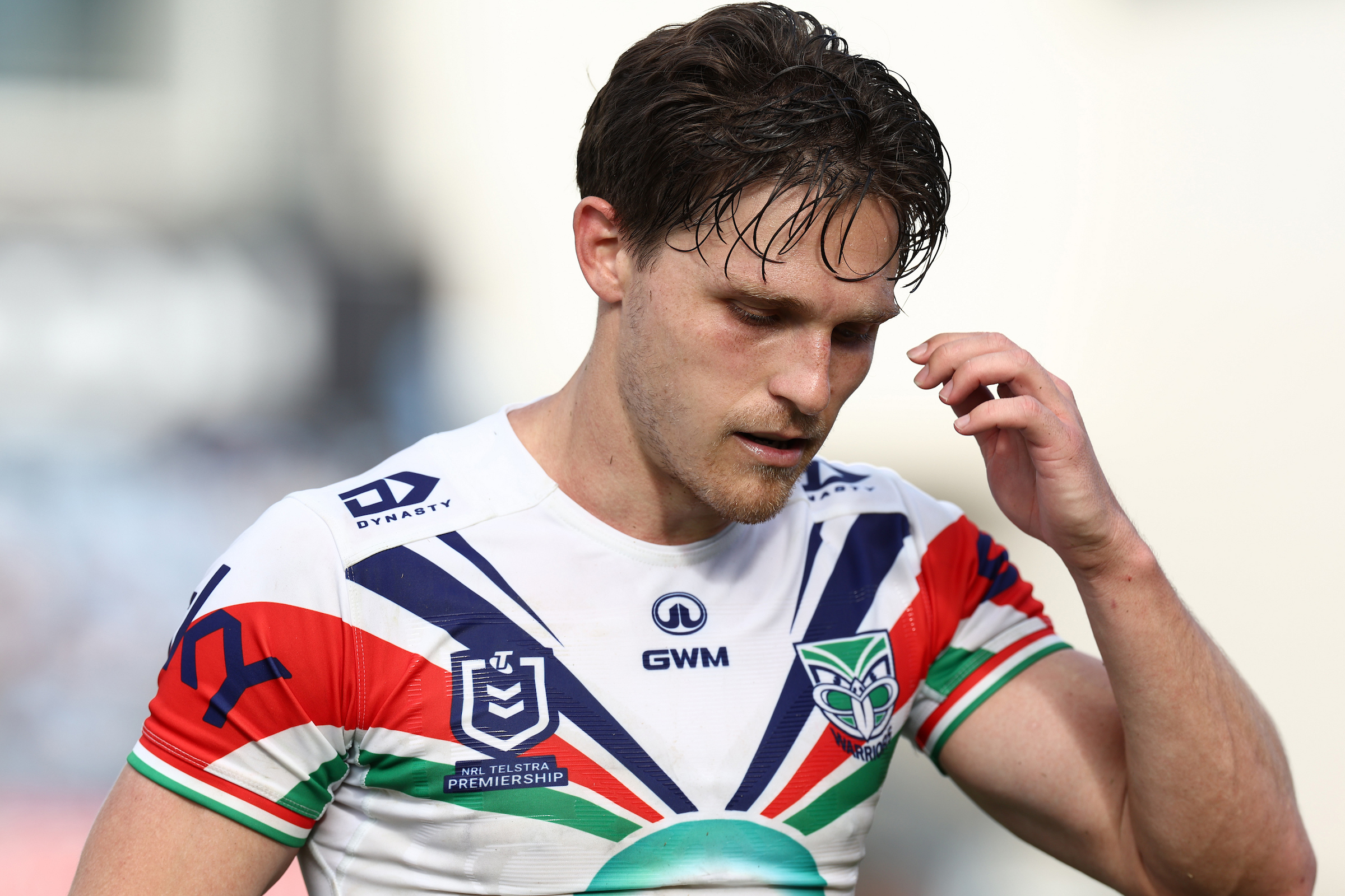 Luke Metcalf of the Warriors reacts after an injury during the match against the Cronulla Sharks. Photo / Photosport