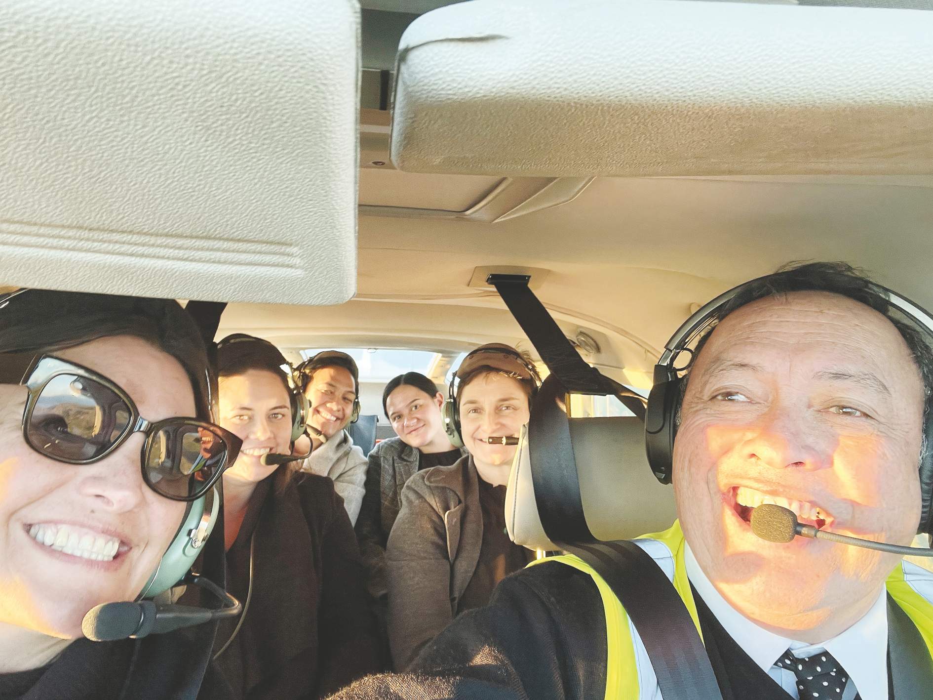 Passengers Maxine Graham, Olivia Hall, Hana O'Regan, Faith Tupara and Urukahinga Rei with Air Ruatōria chief pilot and manuhiri Officer Mahanga Maru early this year.