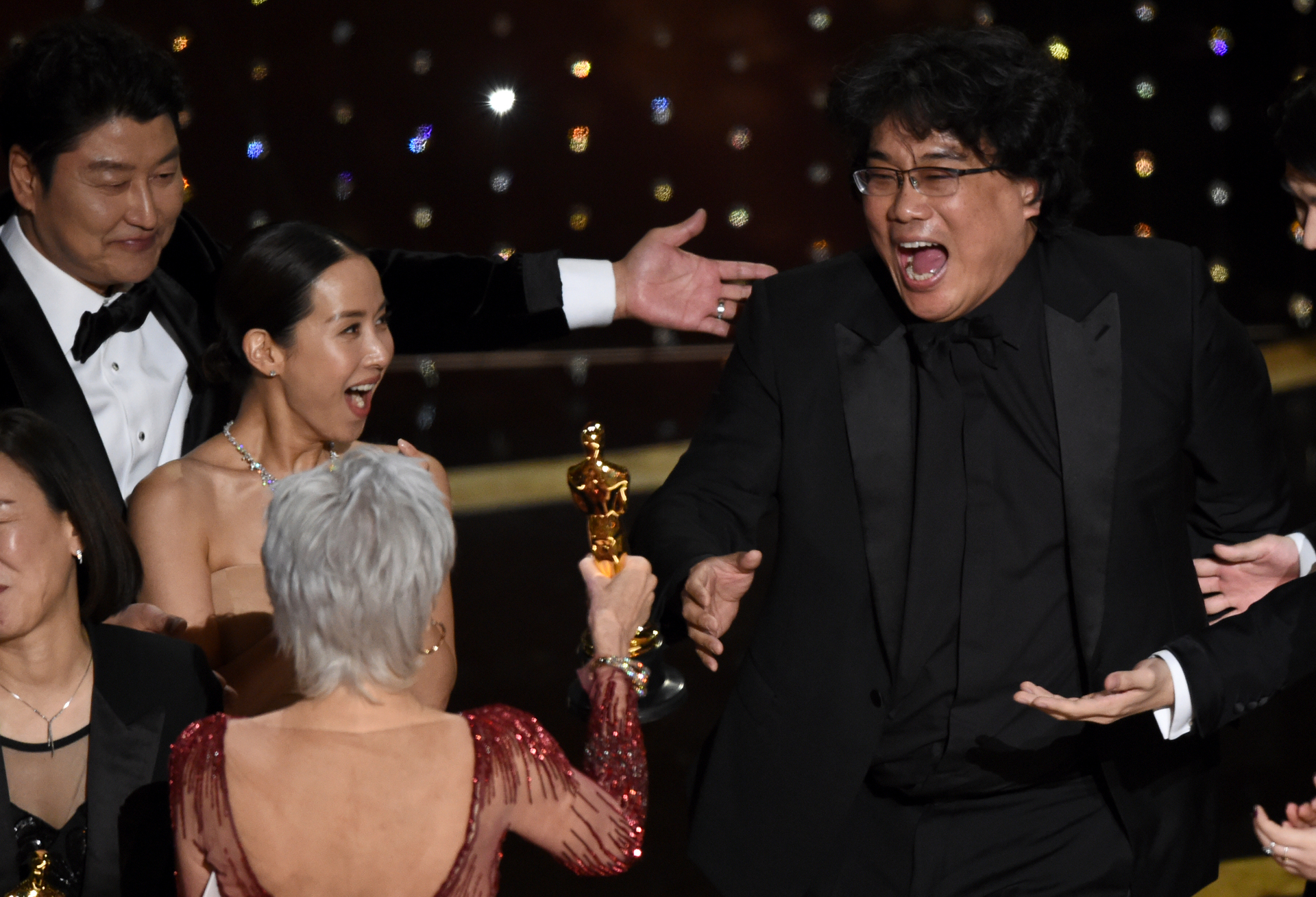 Bong Joon Ho, right, reacts as he is presented with the award for best picture. Photo / AP