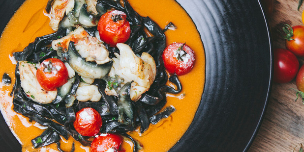 Amisfield's squid ink tagliatelle with paua, crayfish bisque and candied tomato.