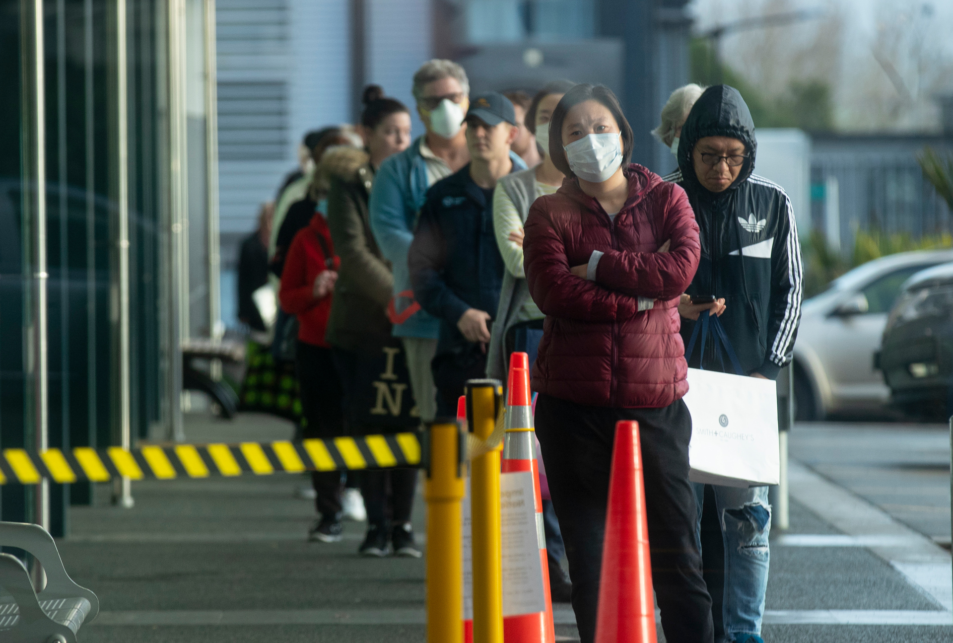 People queue outside Countdown Hobsonville on August 12, soon after the outbreak was announced. Photo / Dean Purcell