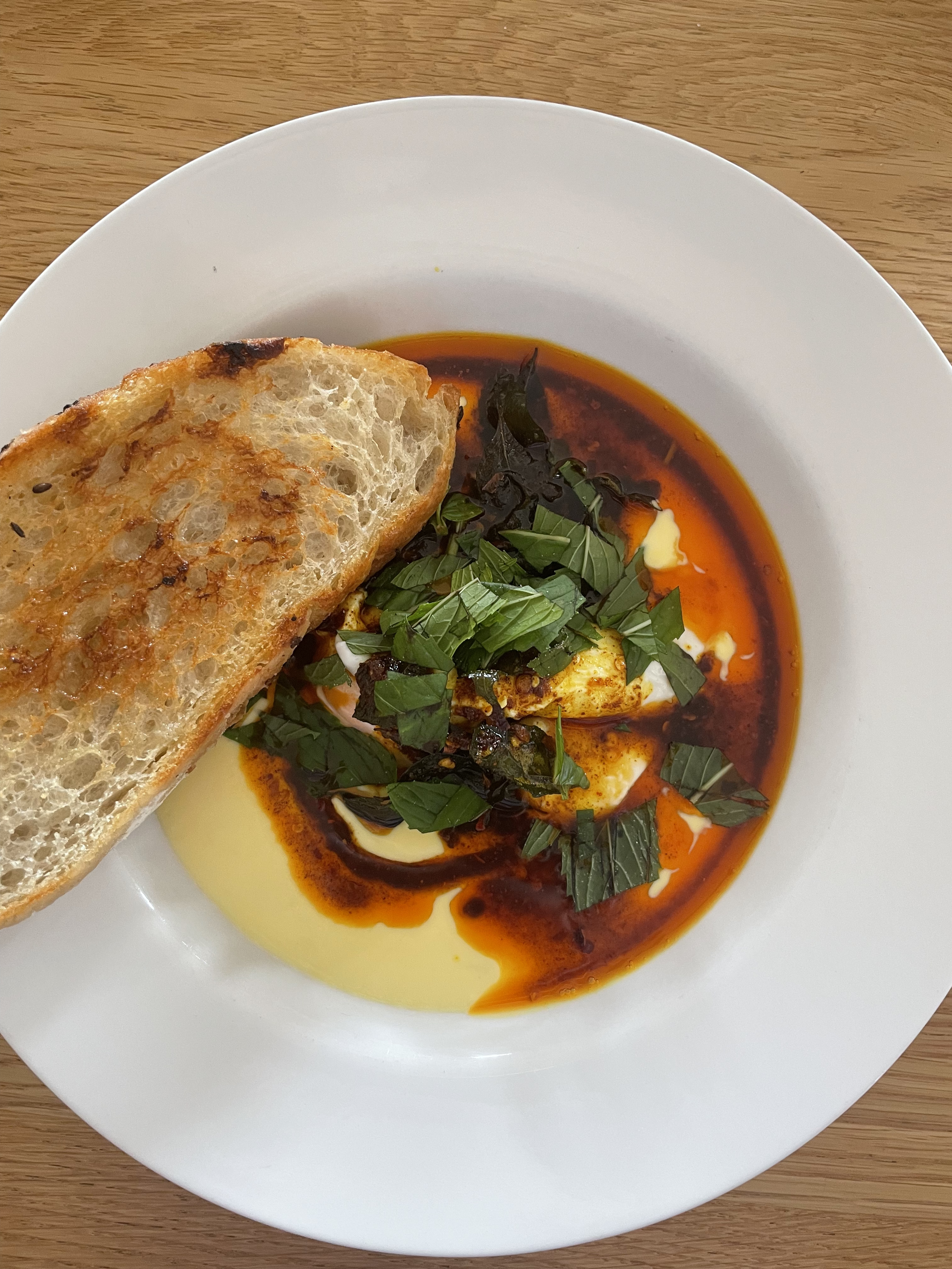 Alby Hailes revels in the indulgent Cilbir eggs with saffron yoghurt and curry.
