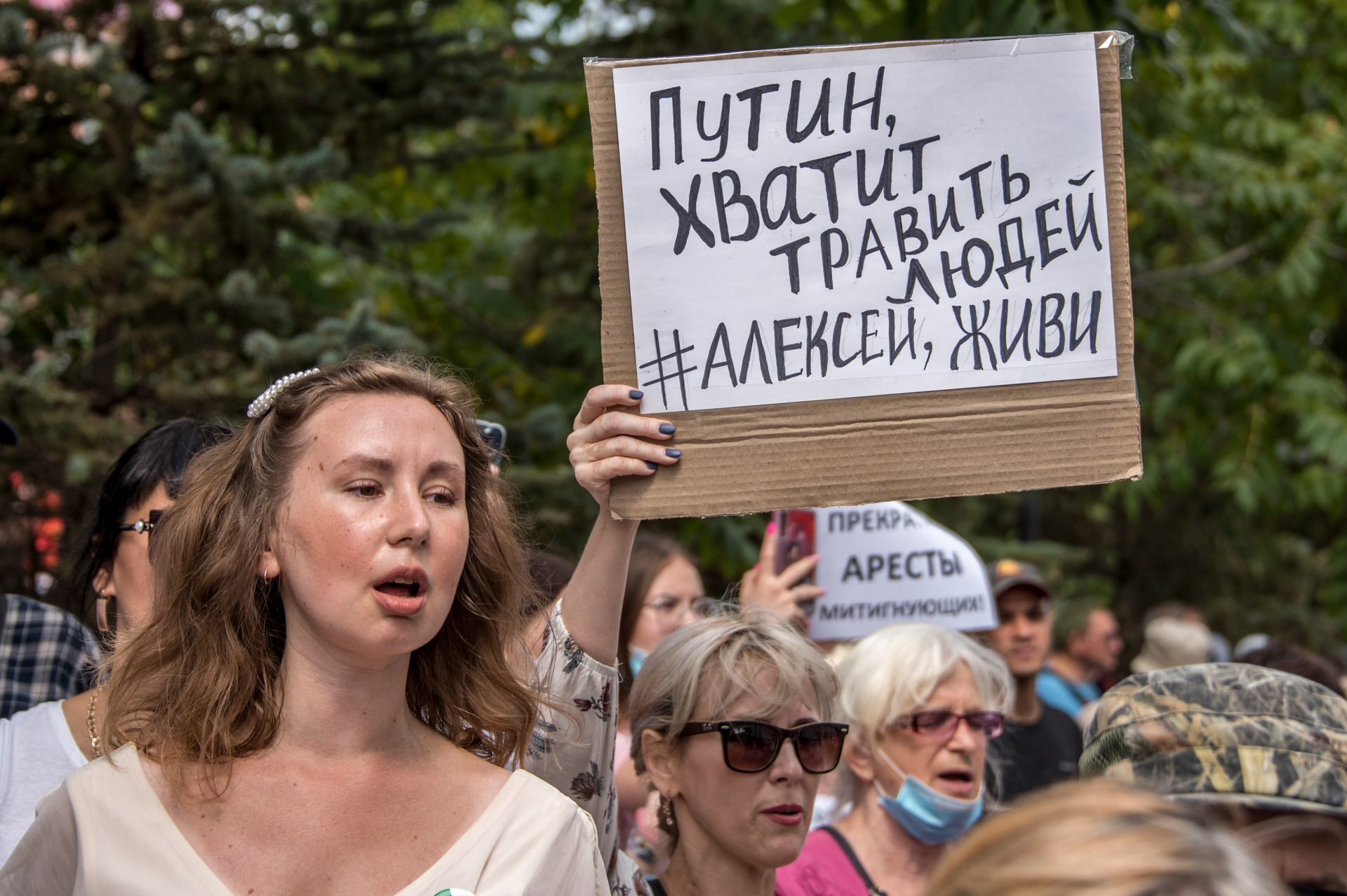 People hold a poster reading 'Putin, stop poisoning people, Alexei you must live' during an unsanctioned protest  in Khabarovsk, east of Moscow. AP Photo / Igor Volkov