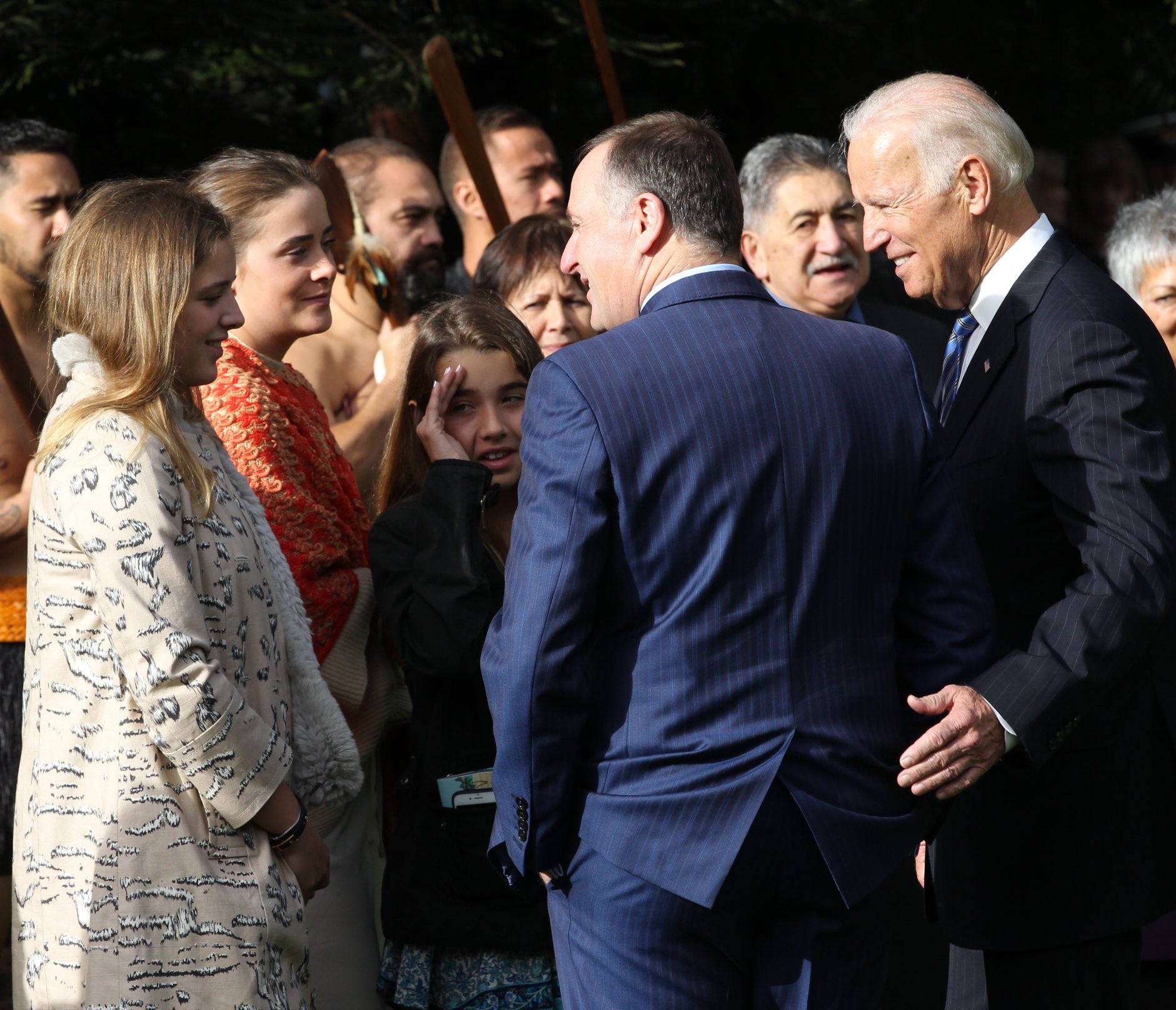 US Vice President Joe Biden introduces John Key to his granddaughters in Auckland. Photo / Greg Bowker